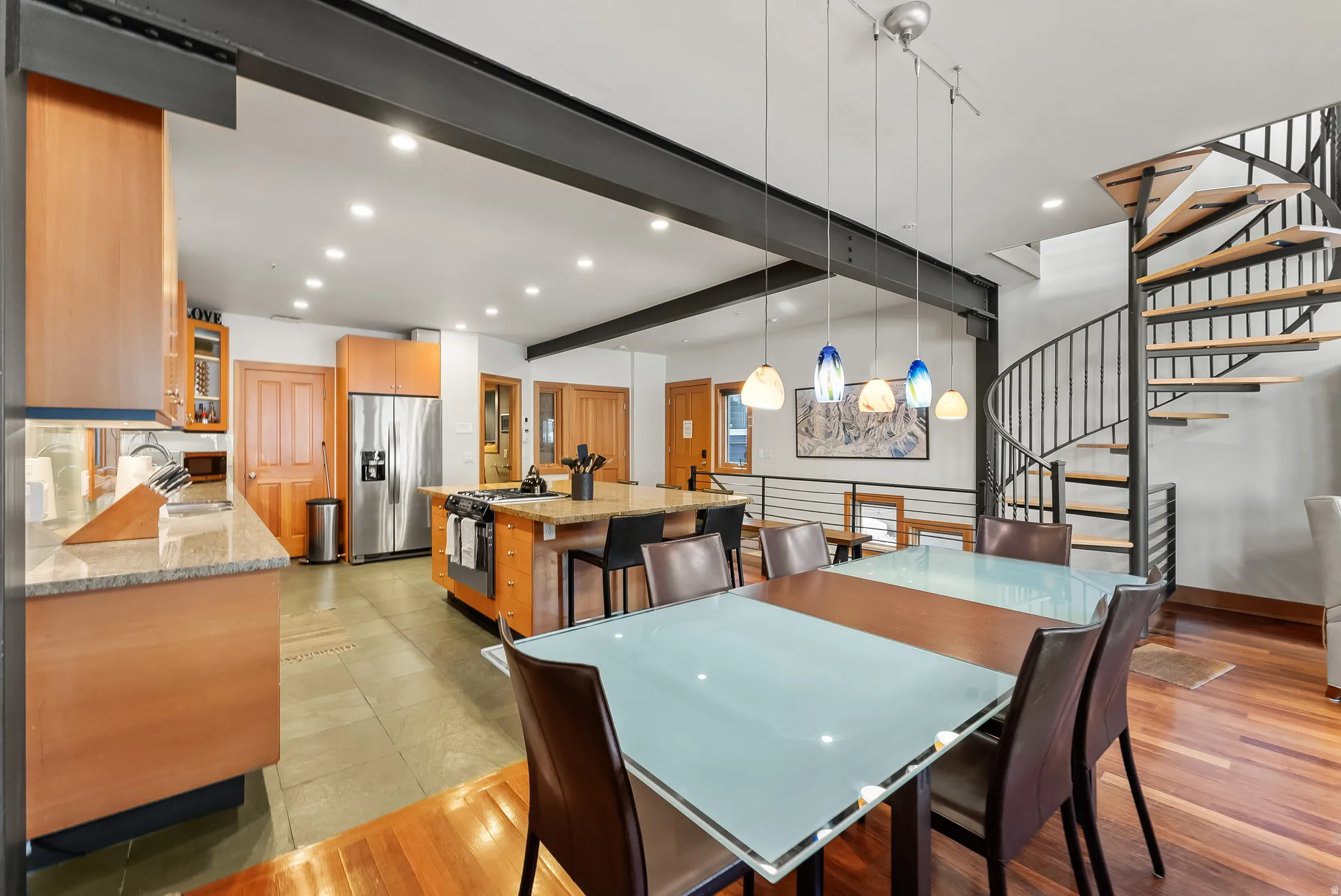 Dining space with recessed lighting, beamed ceiling, and light wood-type flooring