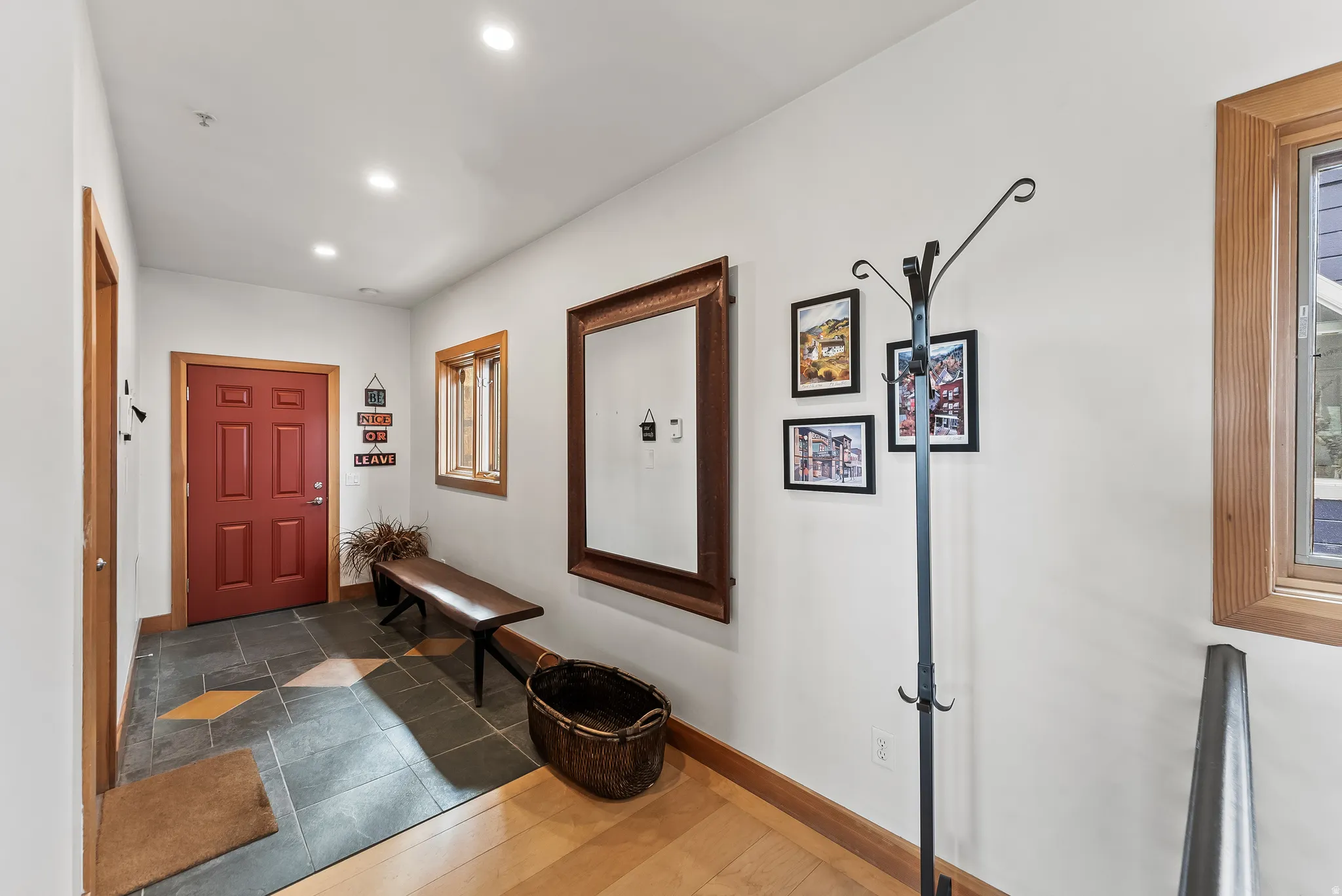 Foyer with wood finished floors and recessed lighting