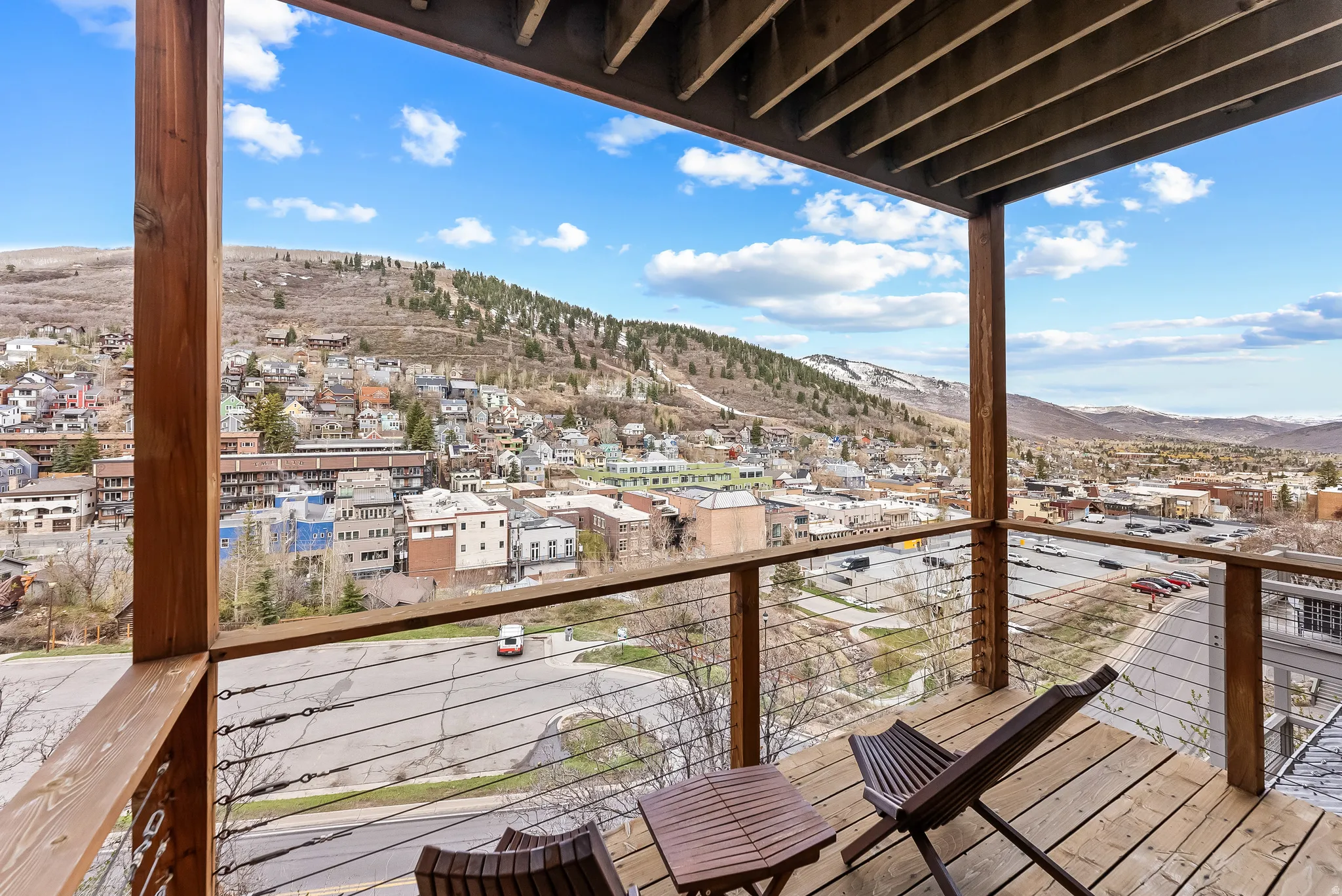 Balcony featuring a mountain view and a residential view