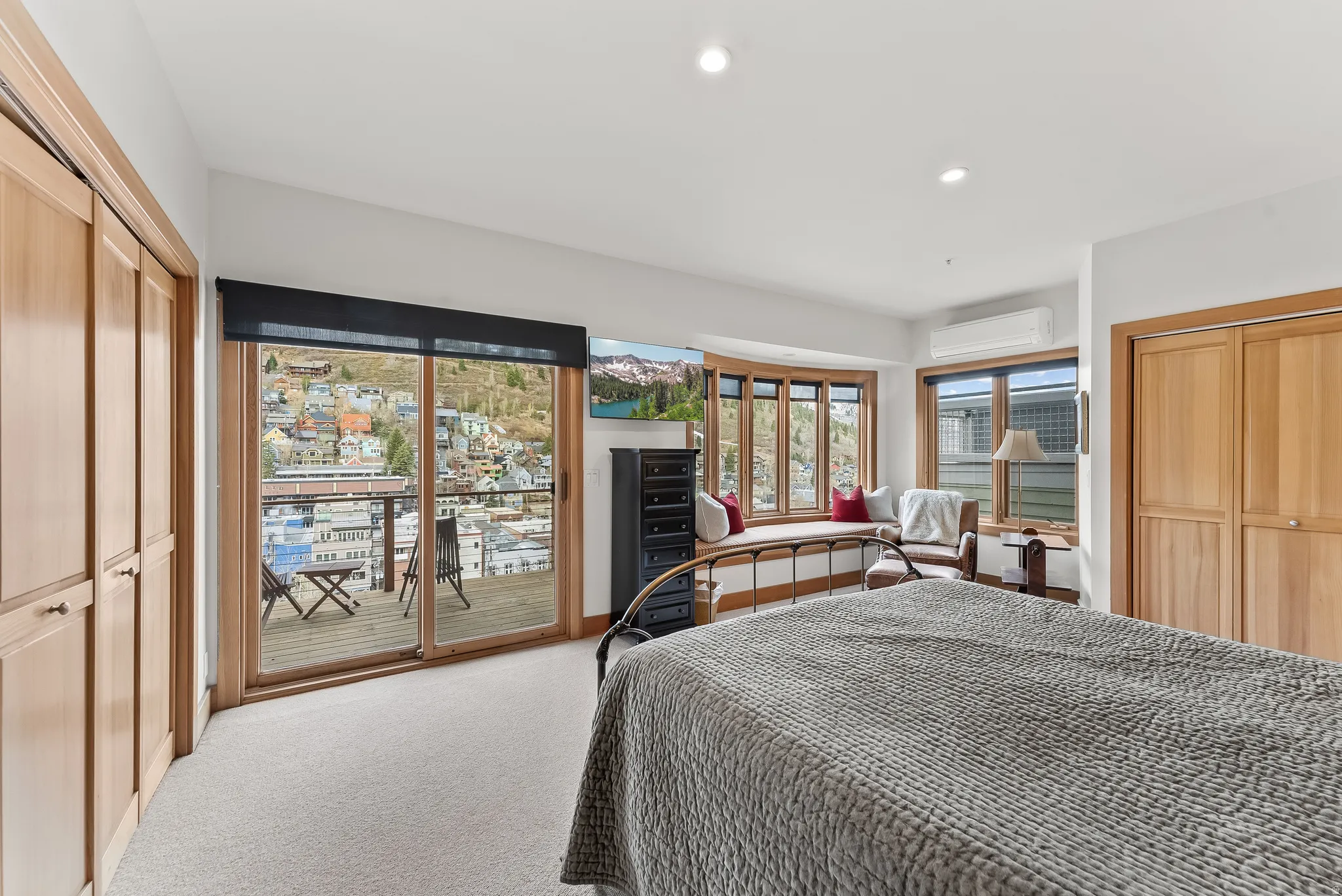 Bedroom with a closet, access to exterior, carpet, and recessed lighting