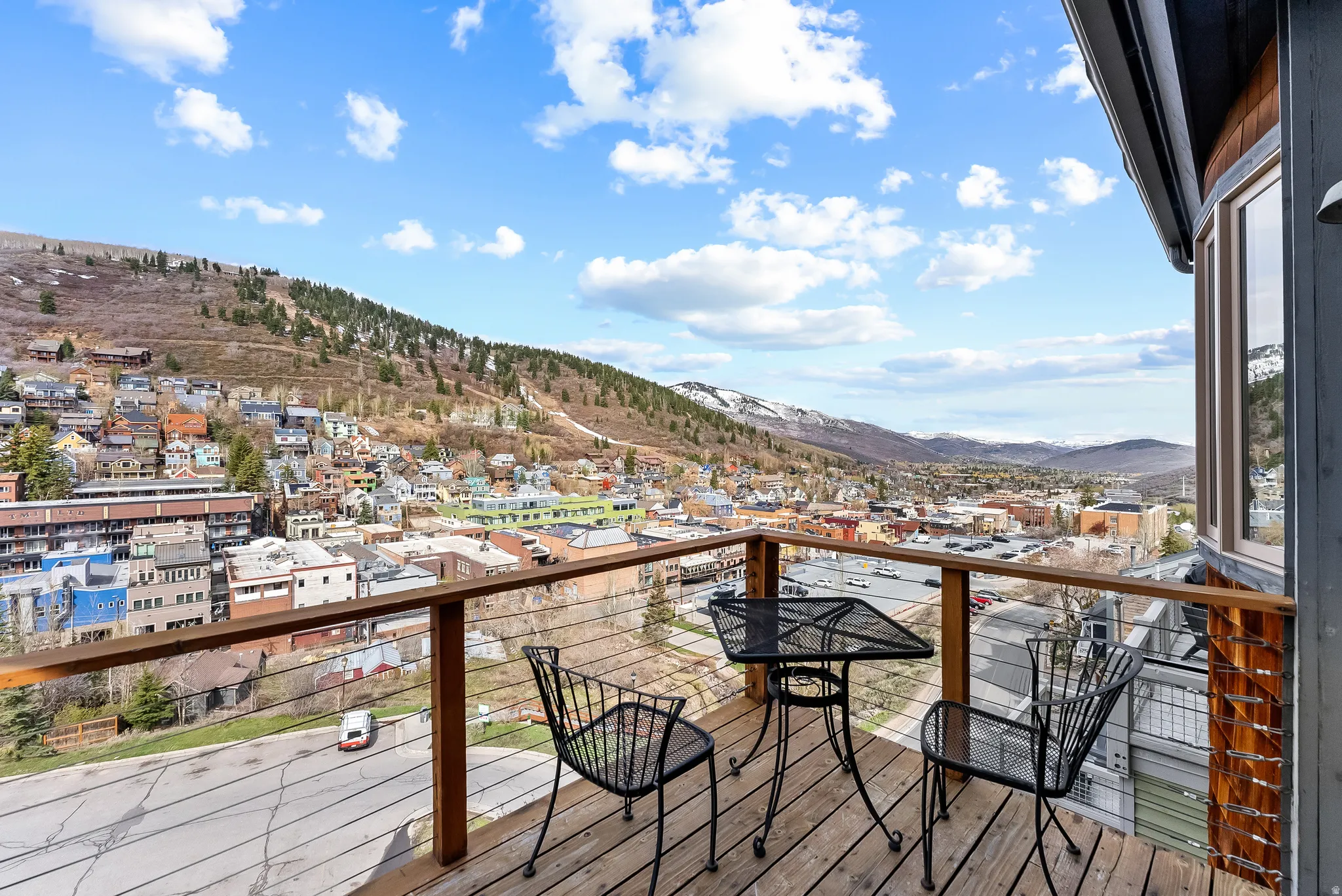 Deck featuring a mountain view and a residential view