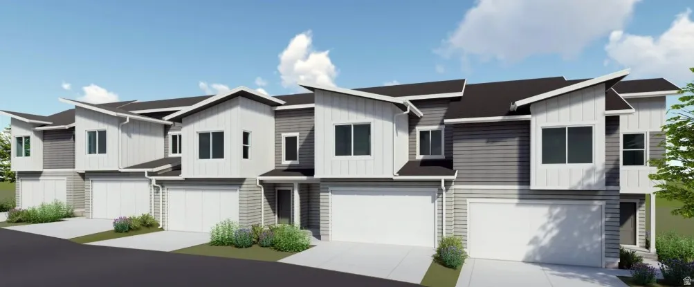 View of front of home featuring concrete driveway, an attached garage, and board and batten siding