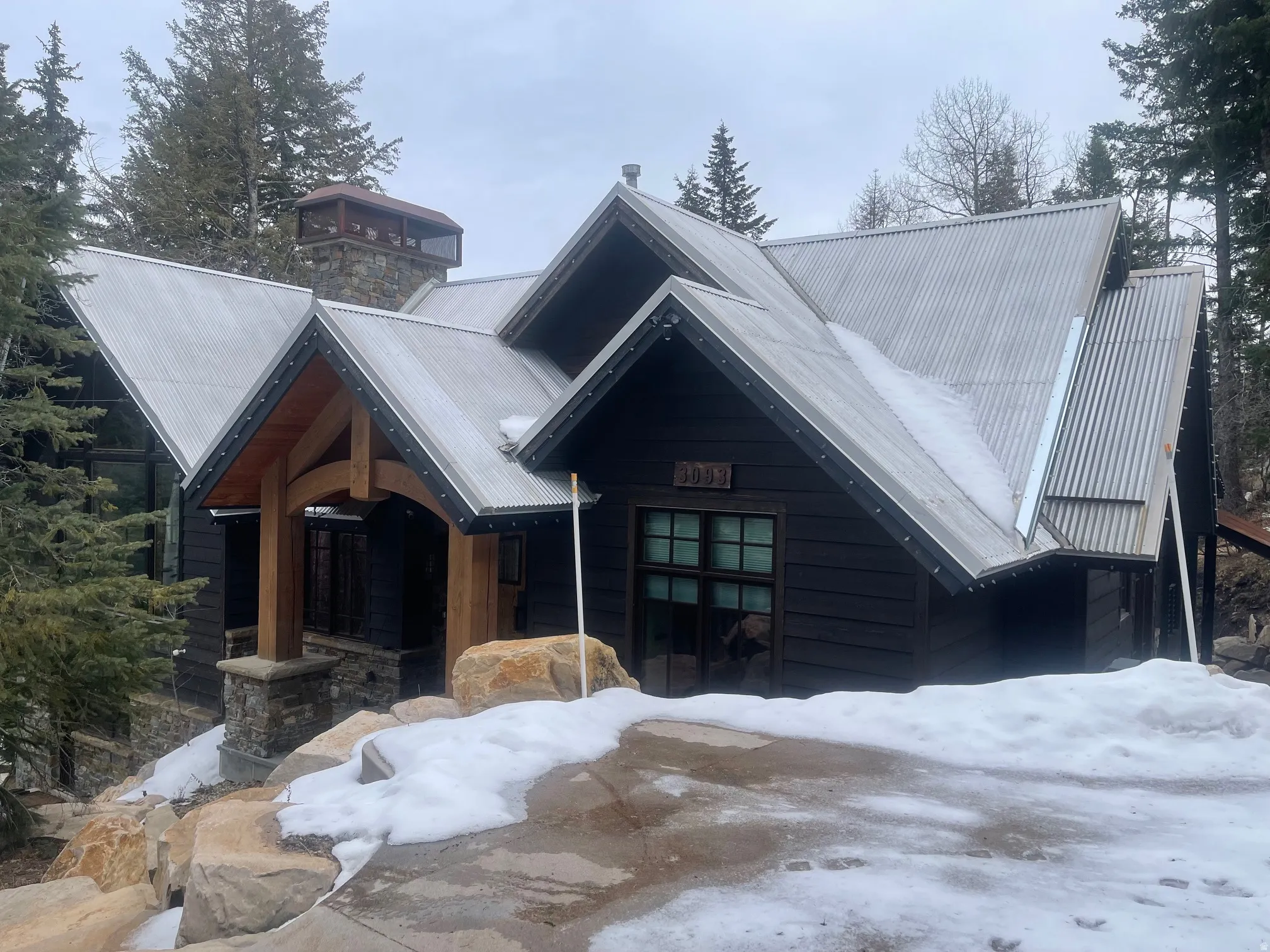 View of front of house with a metal roof