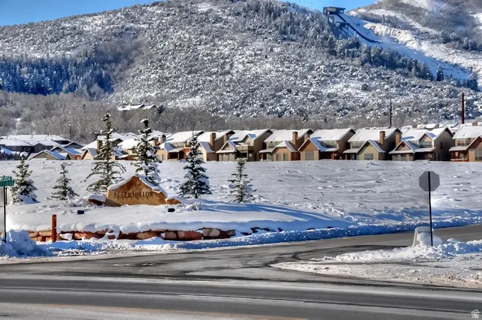 View of mountain backdrop featuring nearby suburban area