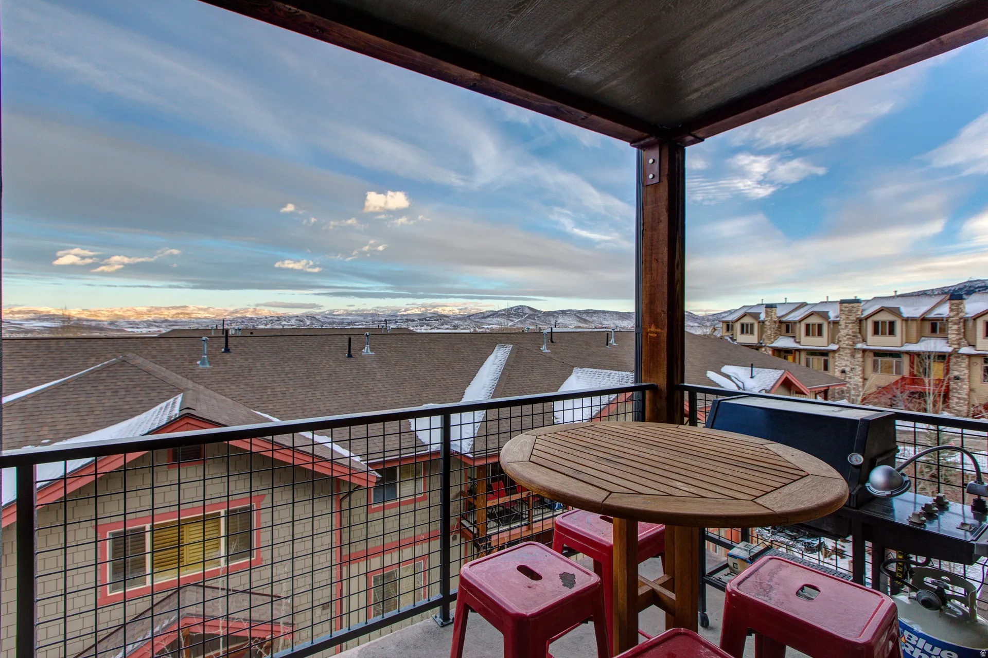 Balcony with a residential view and a mountain view