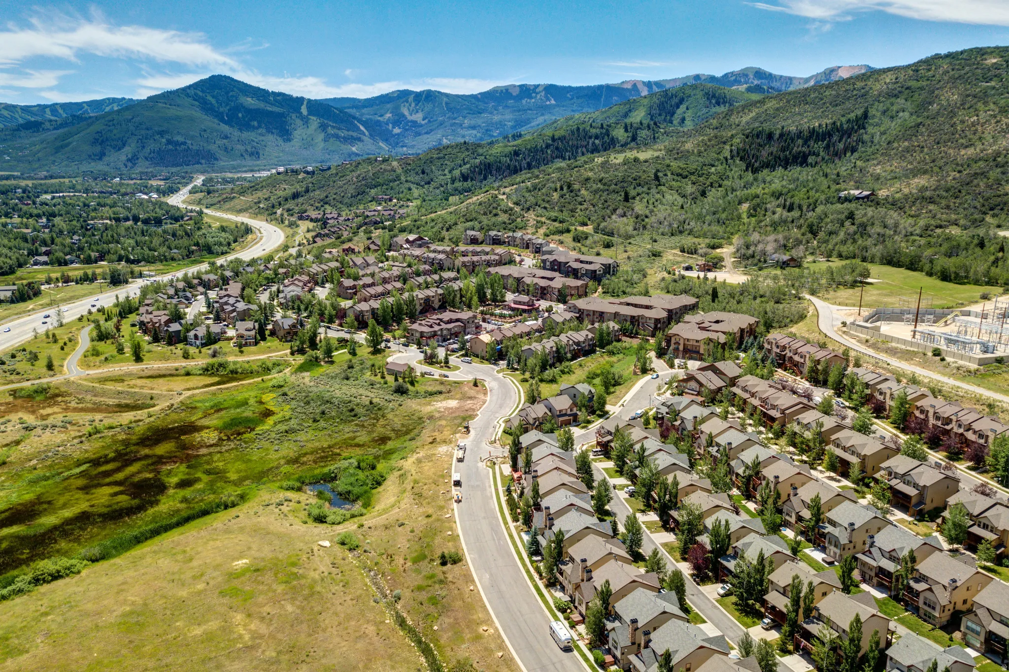 Aerial view of residential area featuring a mountain backdrop