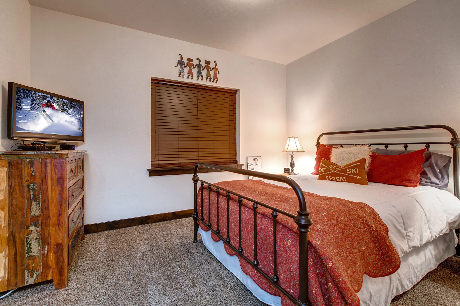 Bedroom featuring carpet flooring and baseboards