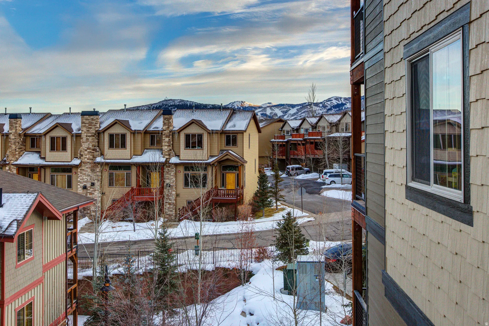 Exterior space featuring nearby suburban area and a mountainous background