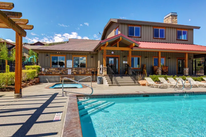 Community pool featuring a patio