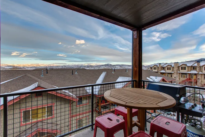 Balcony with a residential view and a mountain view