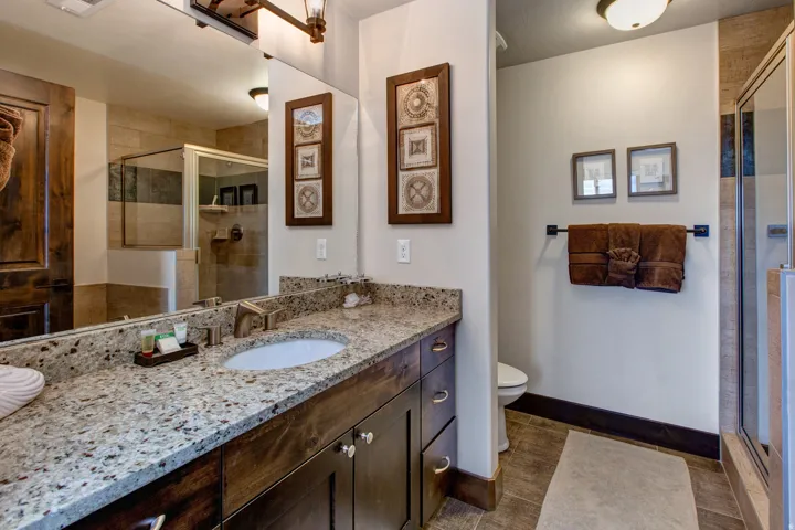 Bathroom featuring vanity and a stall shower