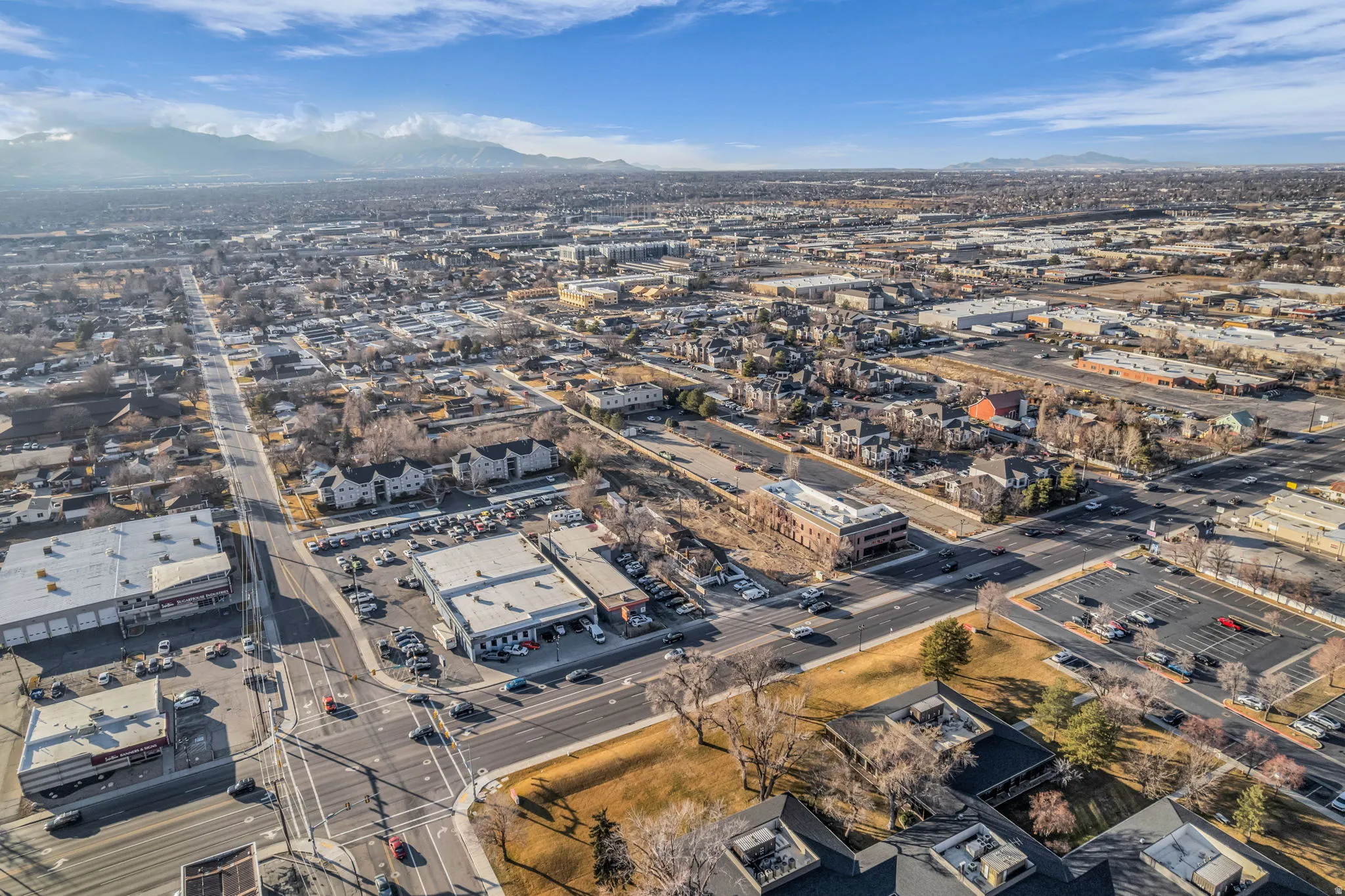 Aerial view of property's location featuring a mountainous background