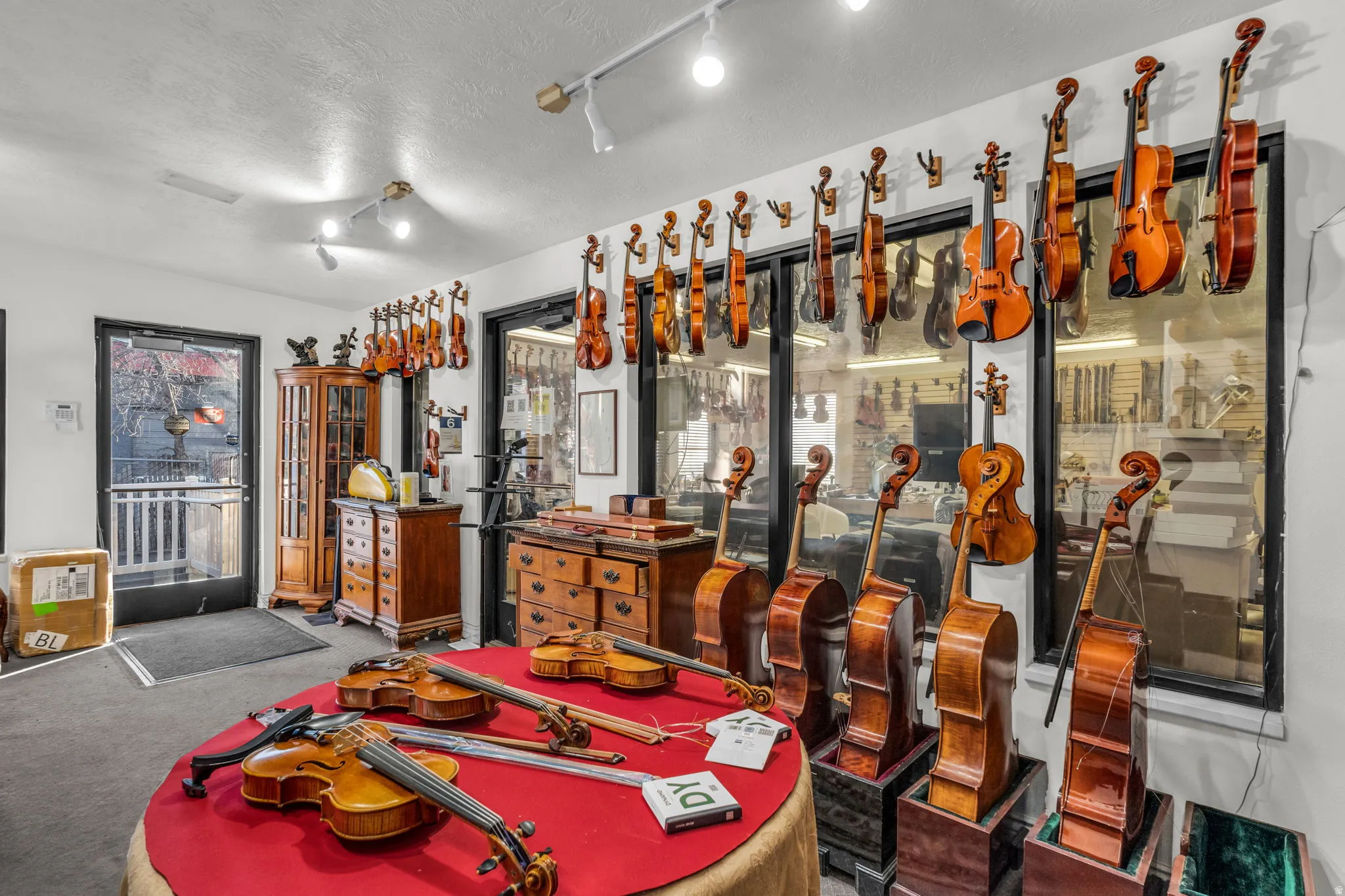 Interior space featuring a textured ceiling and track lighting
