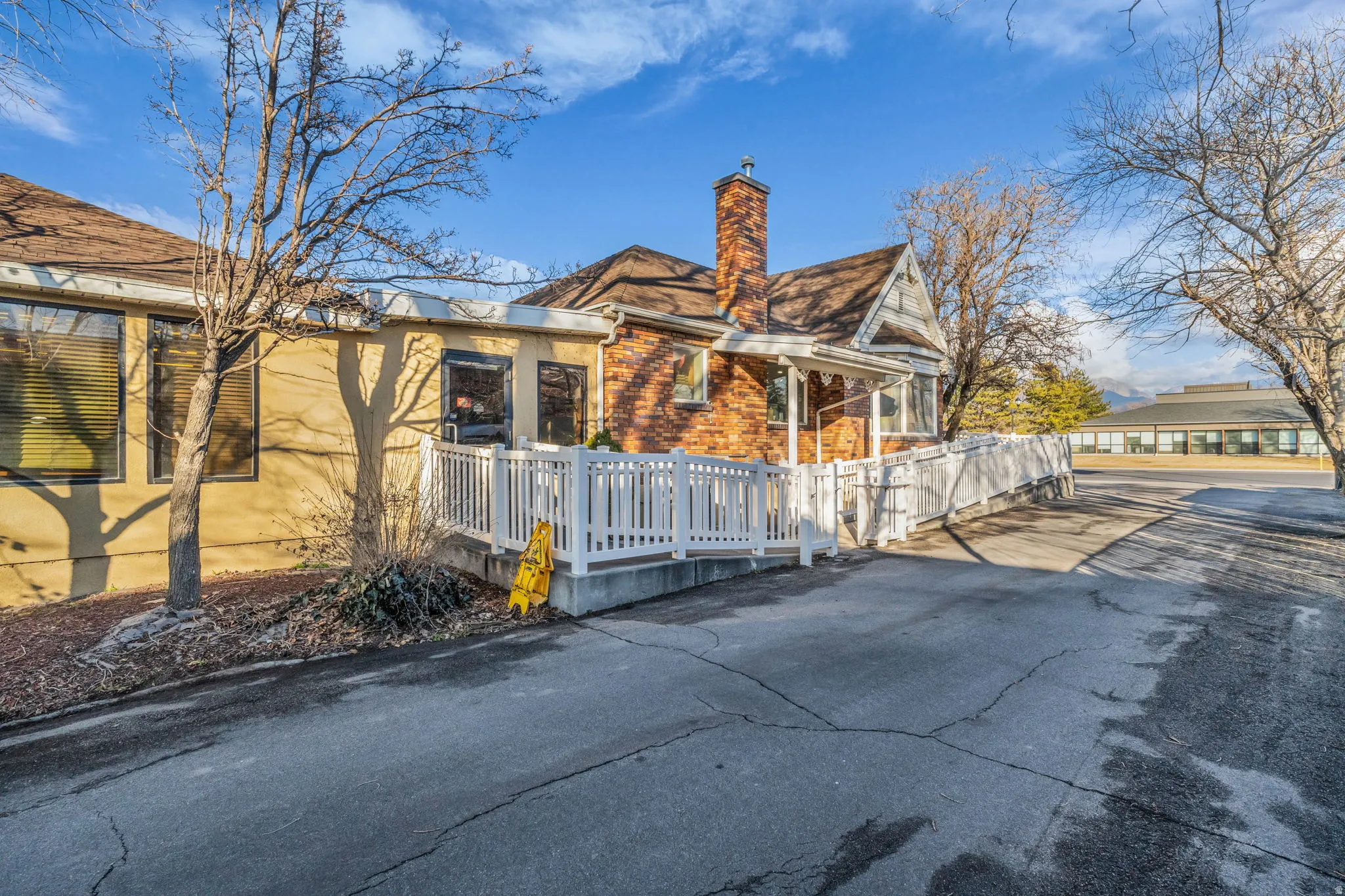 View of property exterior featuring a chimney