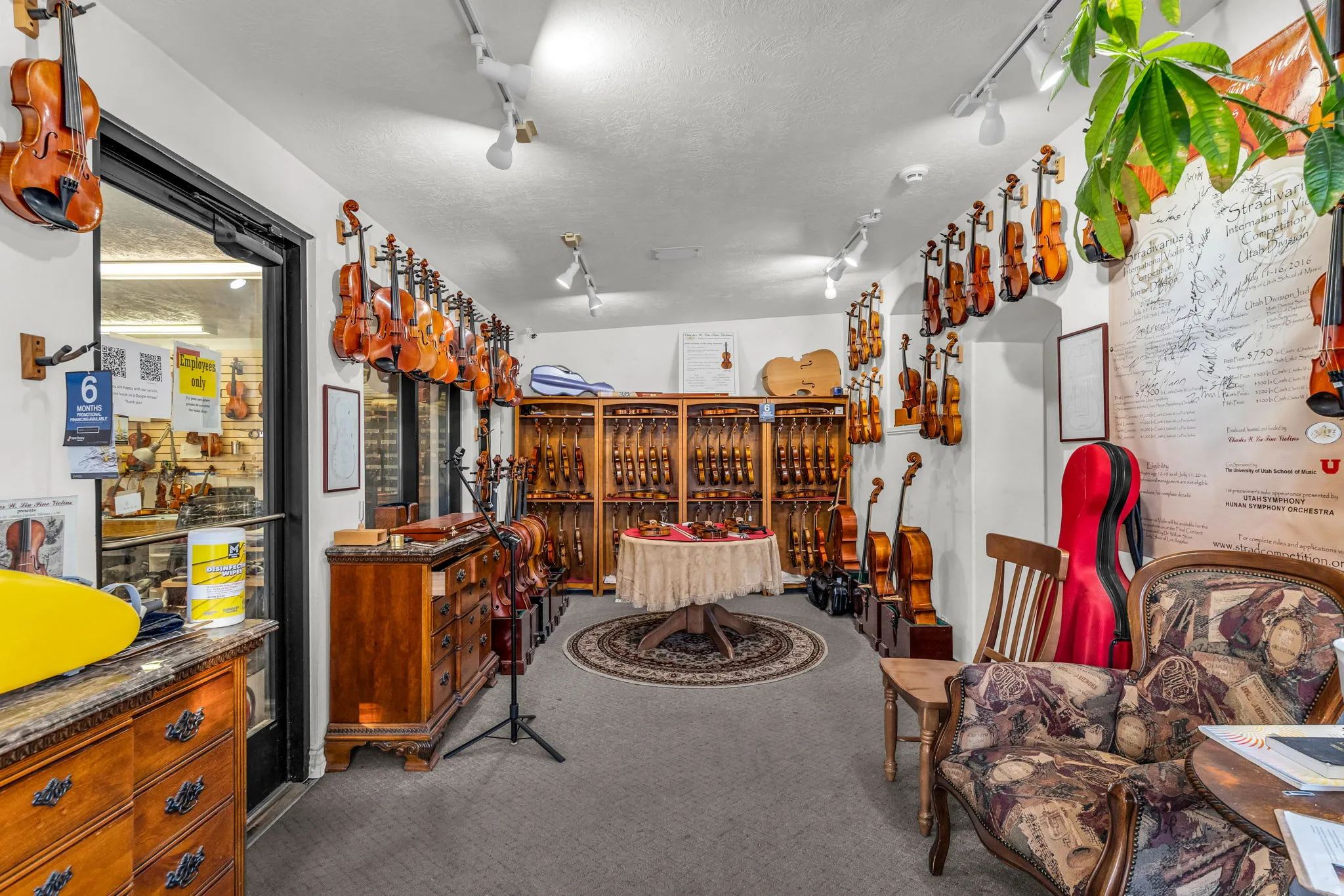 Wine area featuring carpet, track lighting, and a textured ceiling