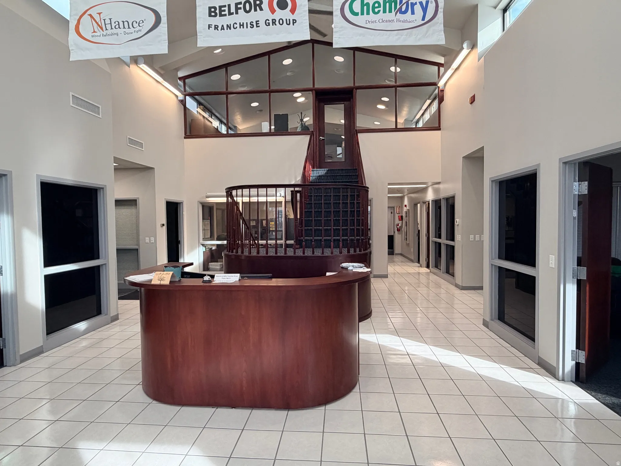 Reception area featuring a high ceiling and recessed lighting