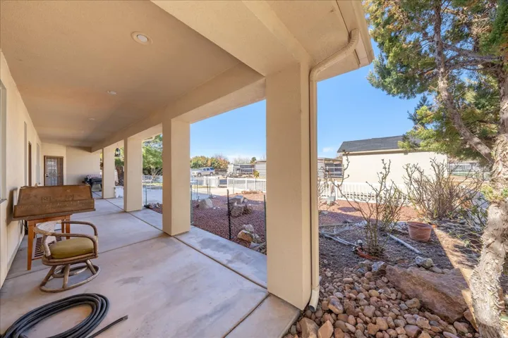 Fenced backyard with a patio area