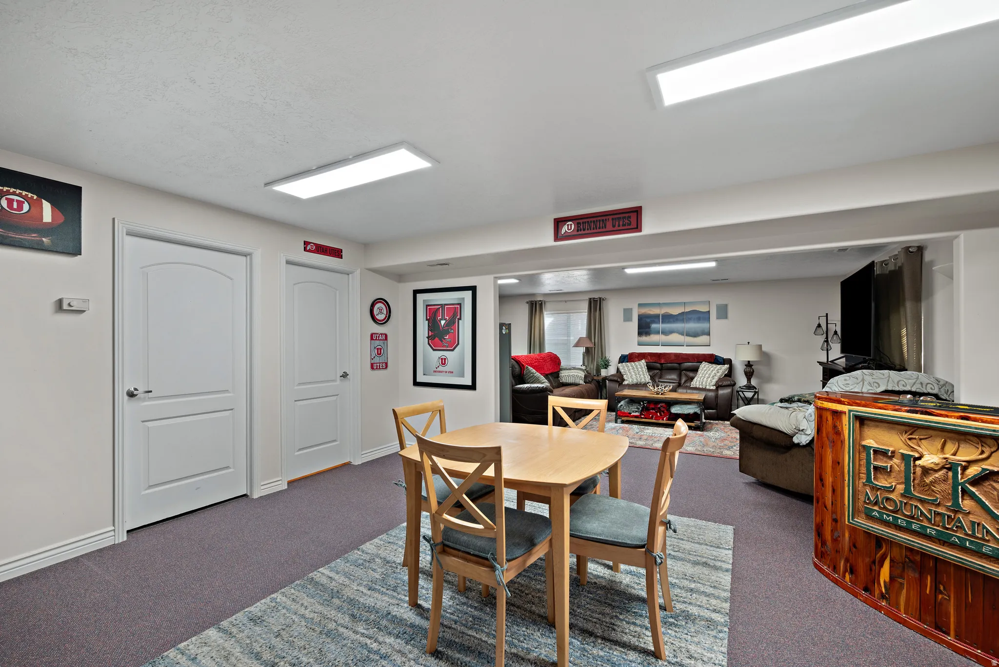 Carpeted dining area with baseboards