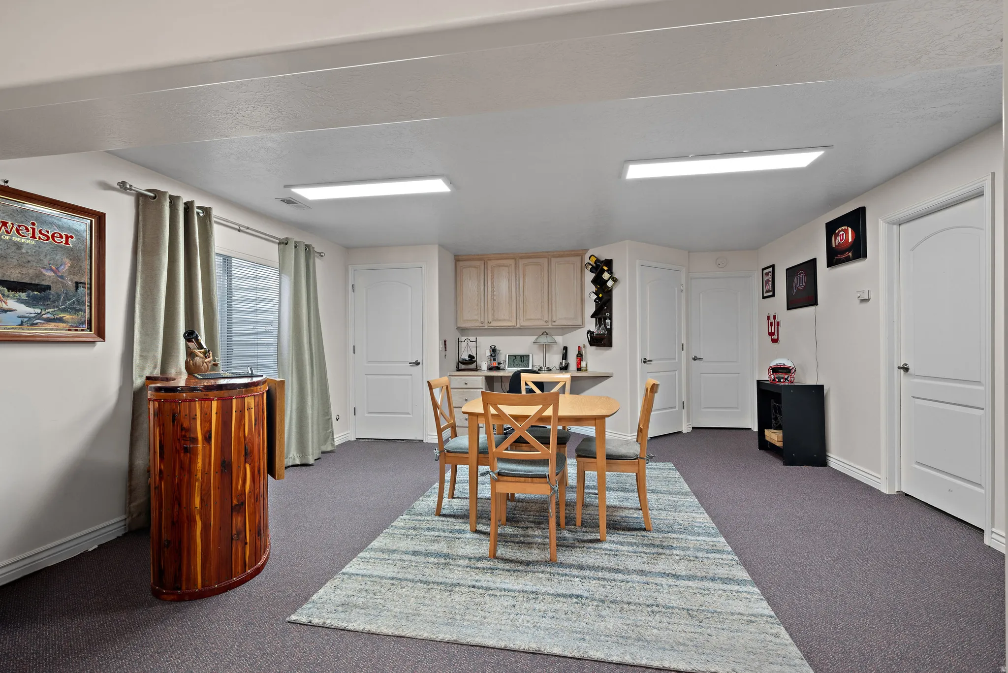 Dining room with baseboards and carpet flooring