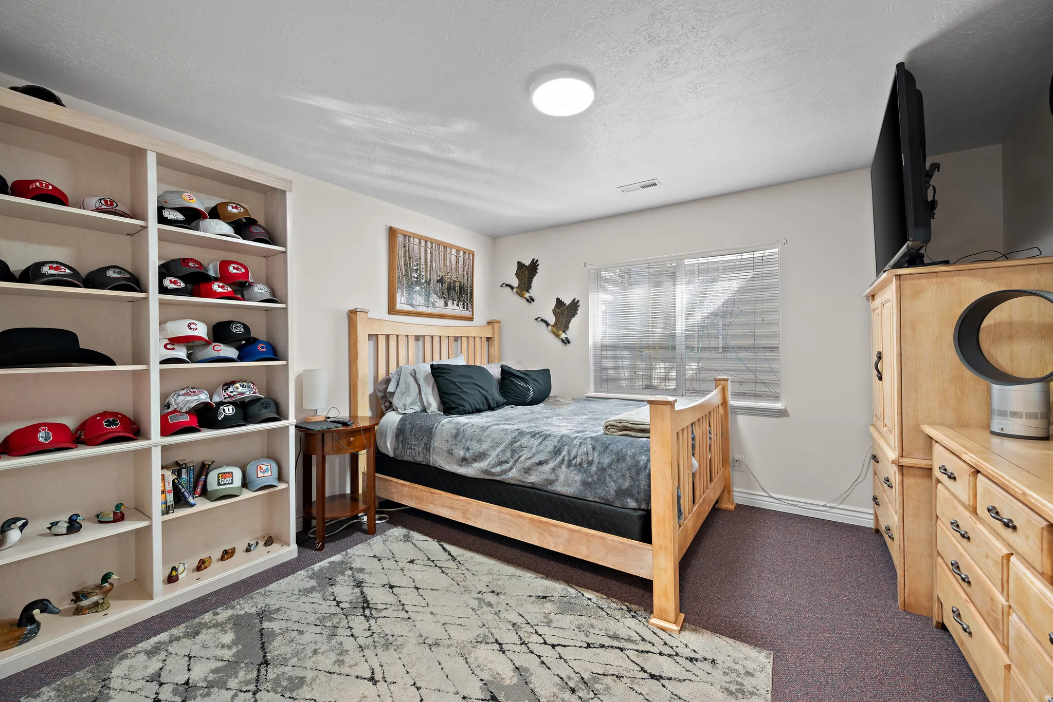 Bedroom with light colored carpet