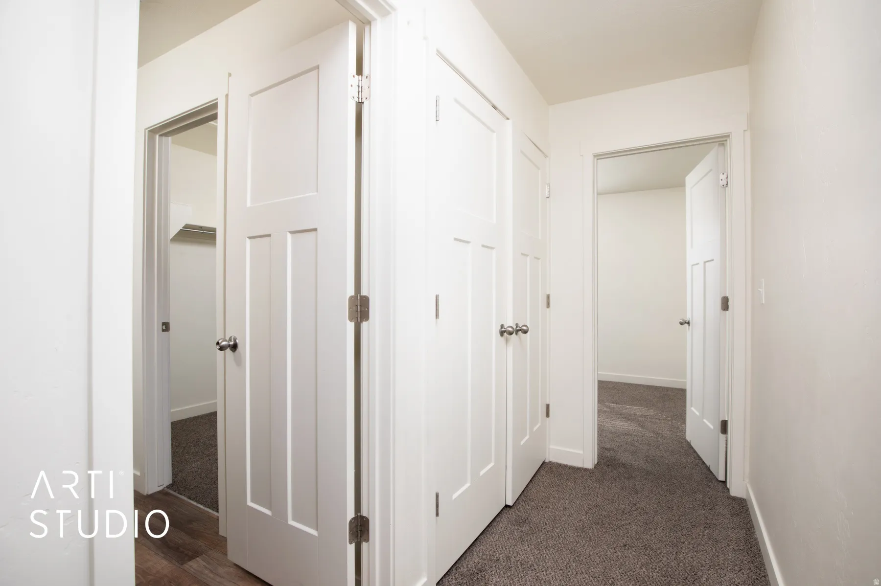 Hallway that leads to bedroom, bathroom, and laundry area.