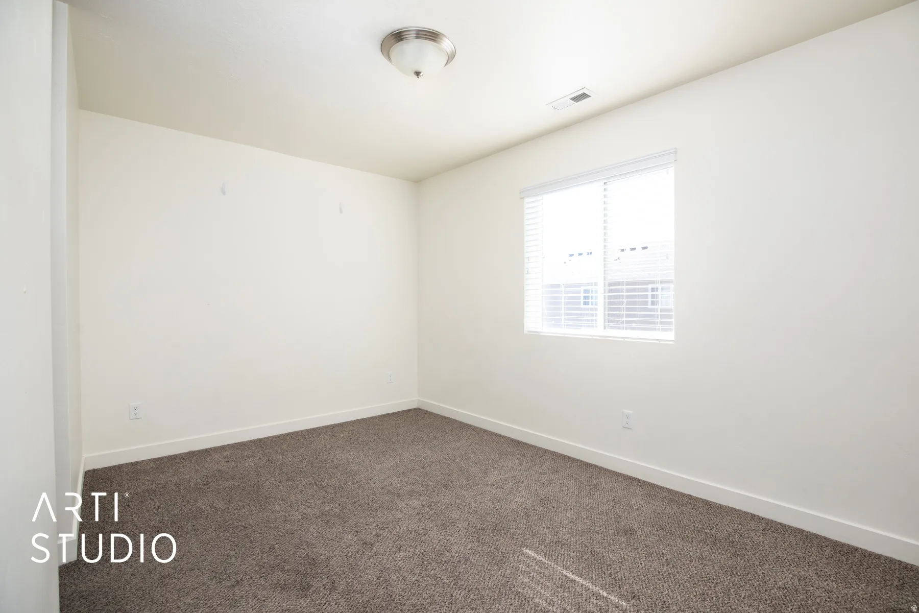 Unfurnished room featuring carpet floors and baseboards