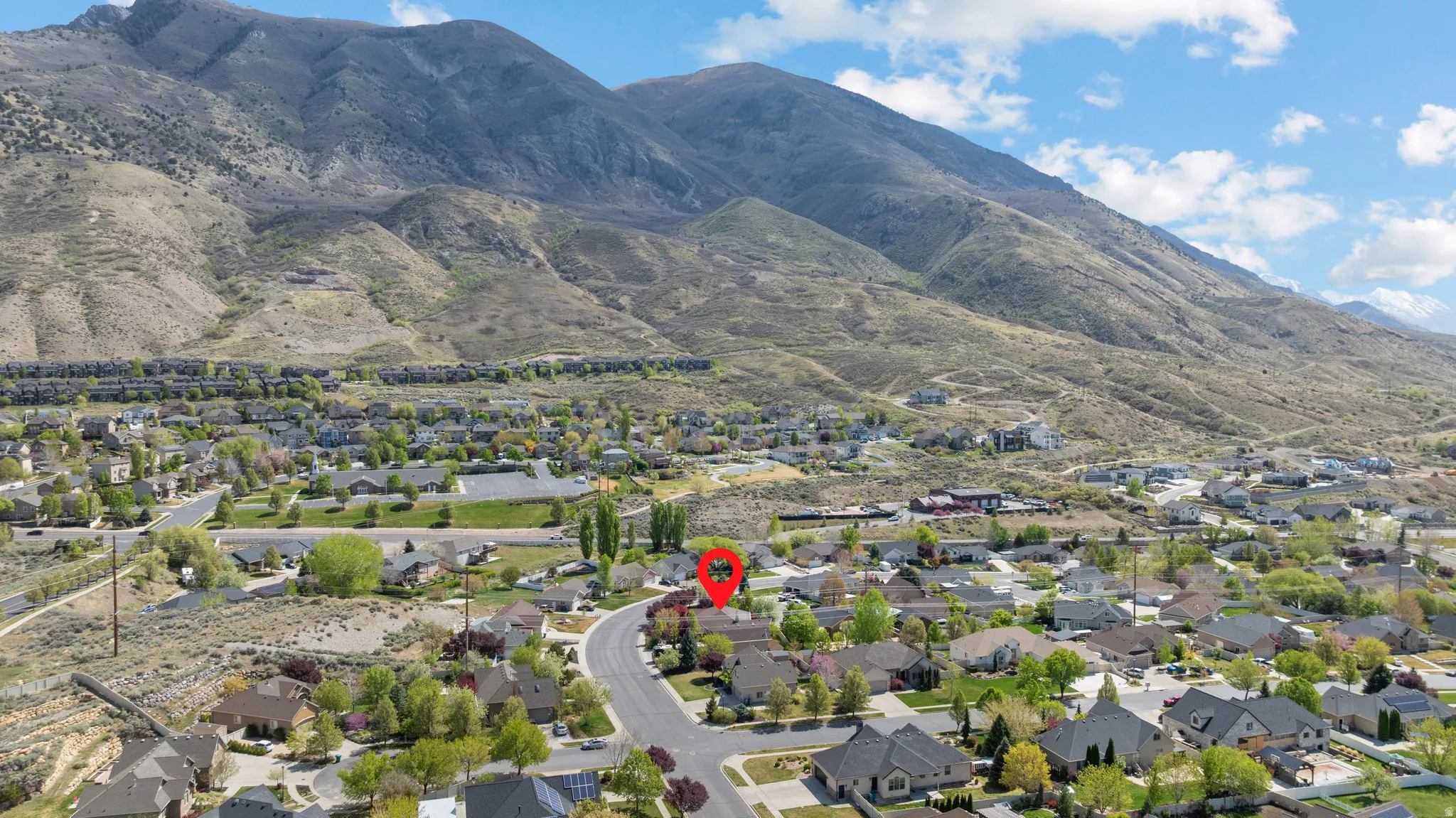Aerial view of residential area with a mountainous background