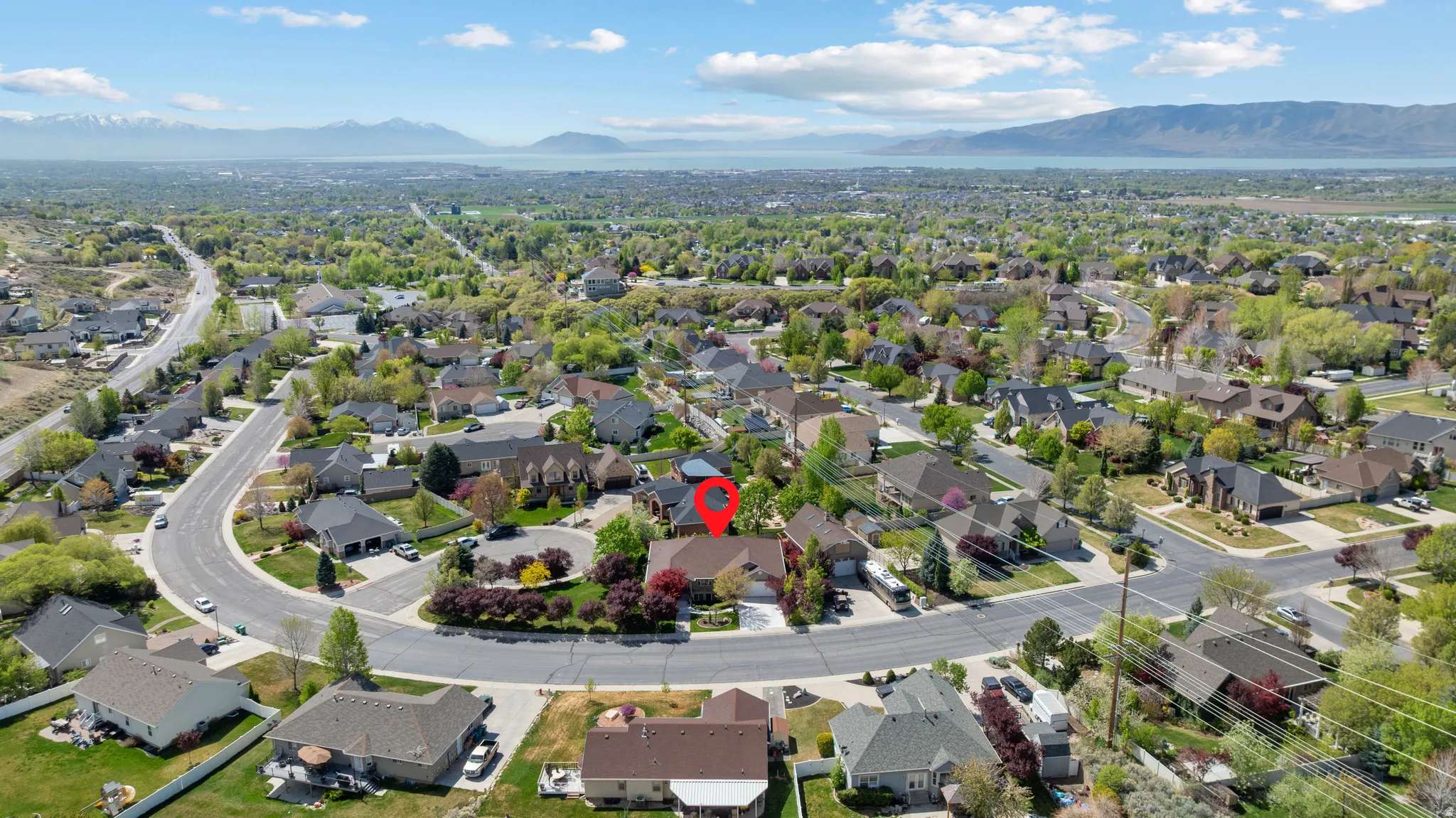 Aerial view of residential area featuring a mountain backdrop
