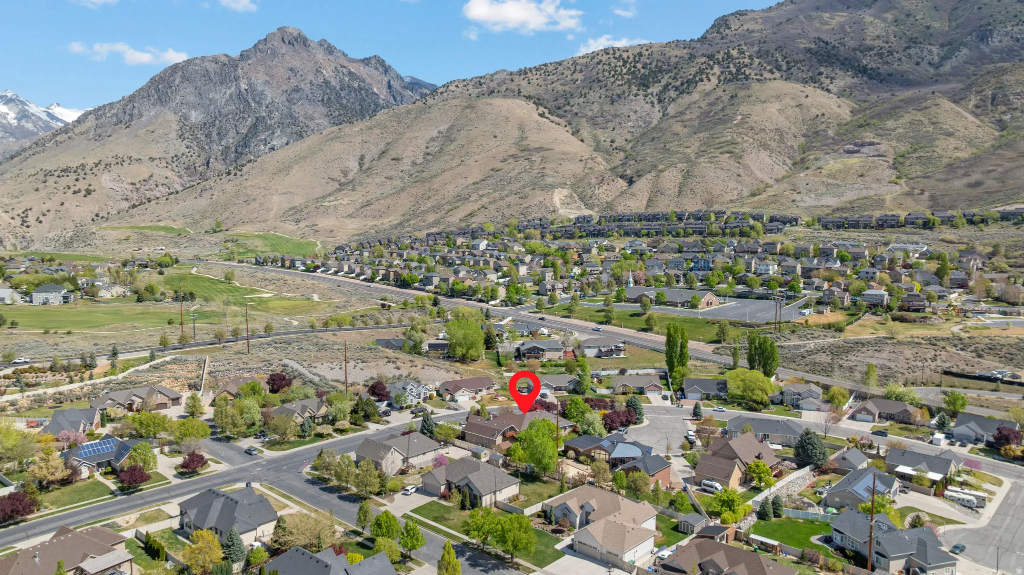 Aerial view of residential area featuring mountains