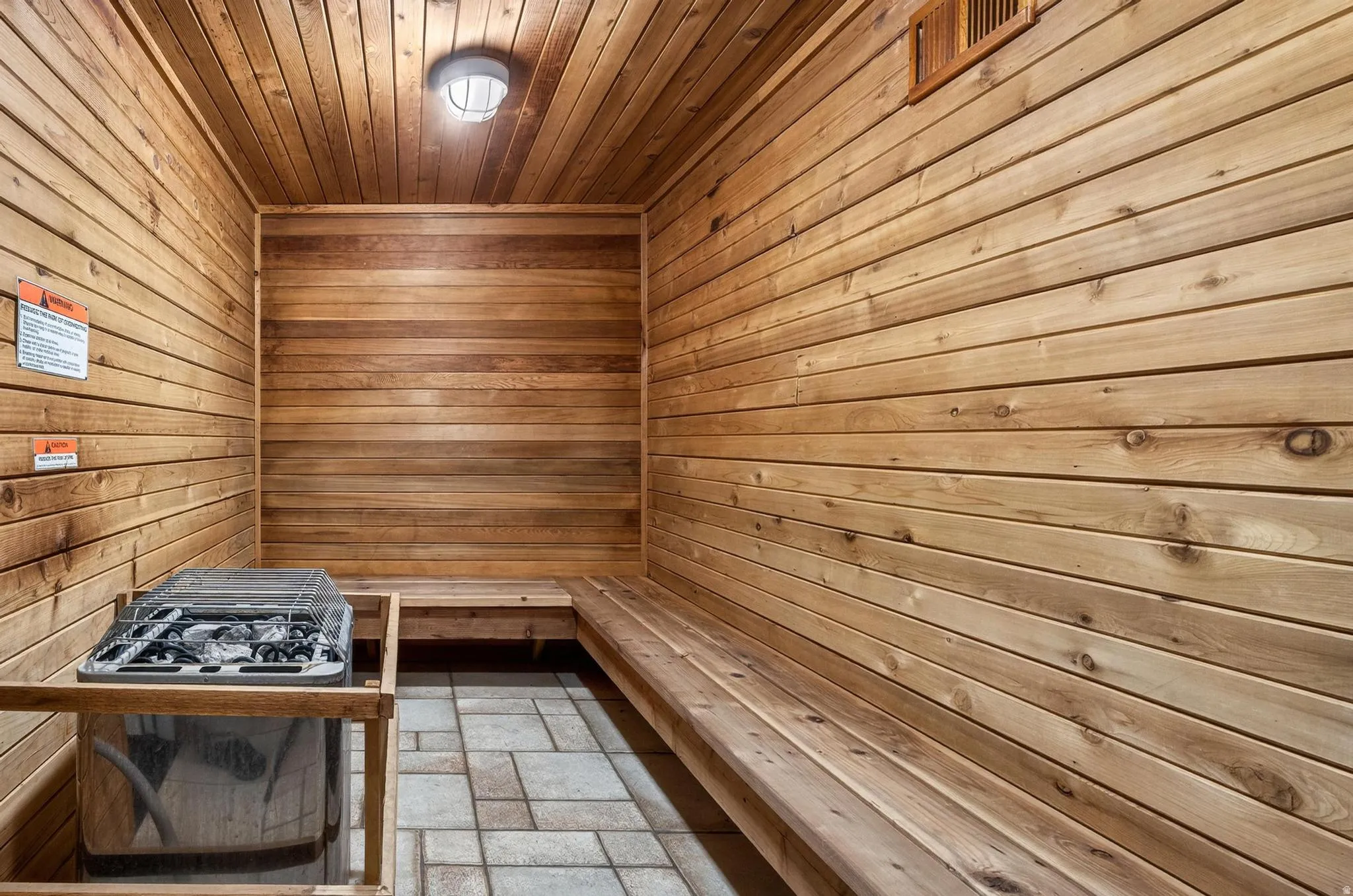 Sauna / steam room featuring wood walls and wood ceiling