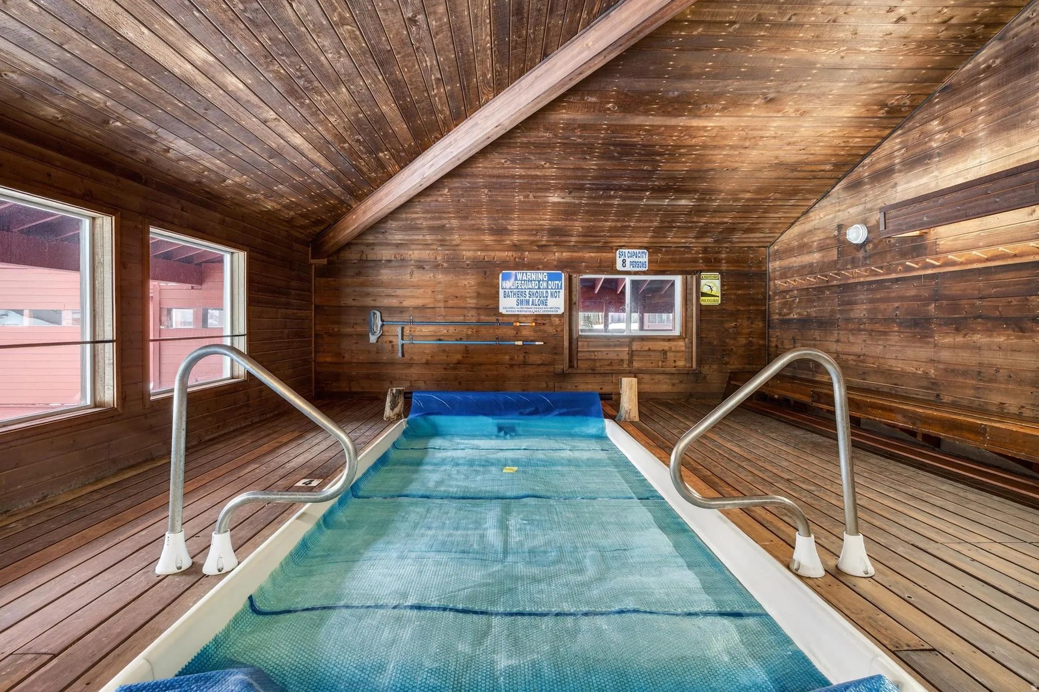 View of pool featuring a hot tub
