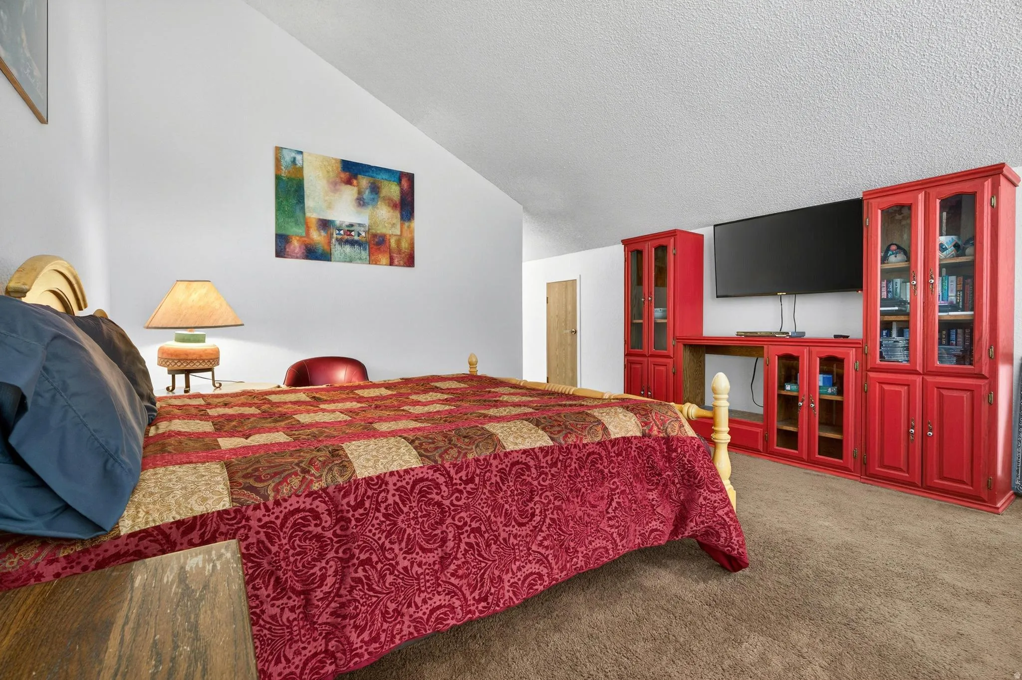 Bedroom featuring light carpet