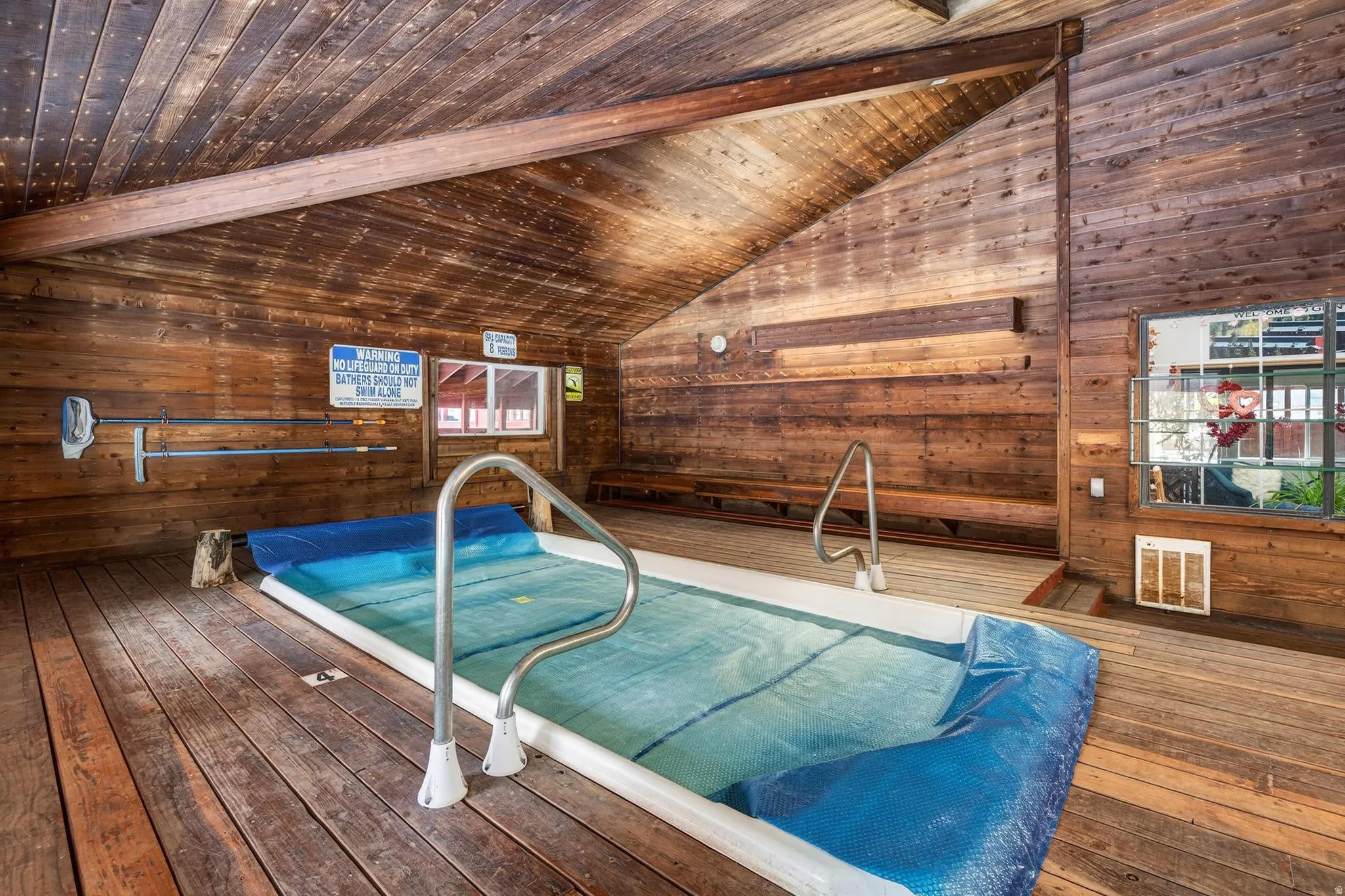 View of swimming pool featuring a jacuzzi