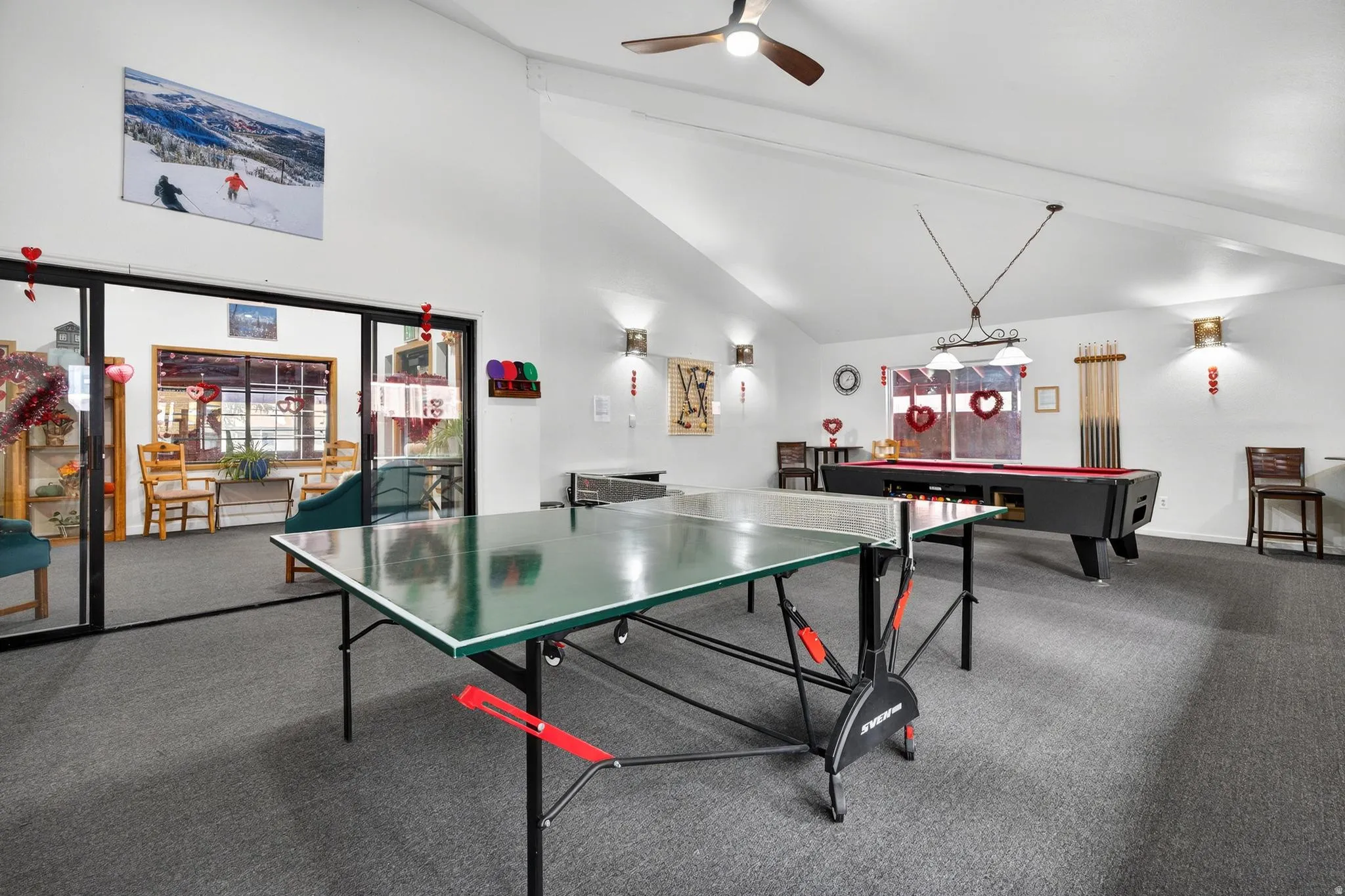 Recreation room featuring ceiling fan, lofted ceiling, and pool table