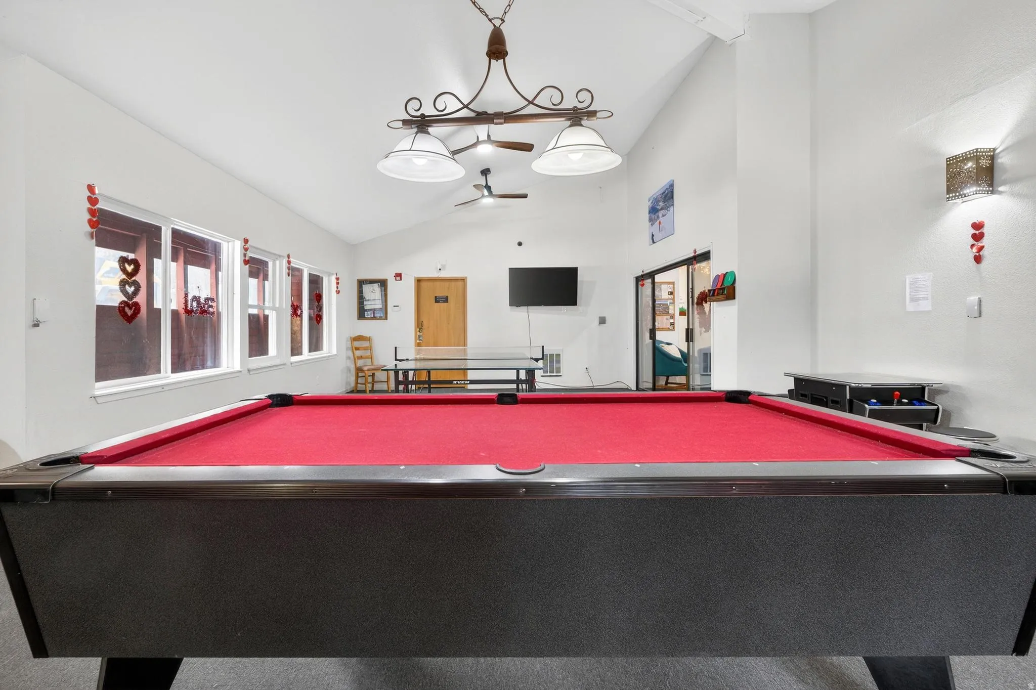 Recreation room featuring ceiling fan, vaulted ceiling, and pool table