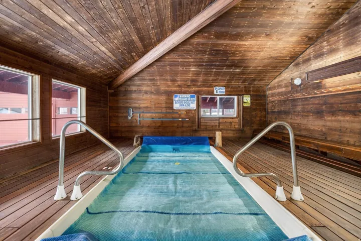 View of pool featuring a hot tub