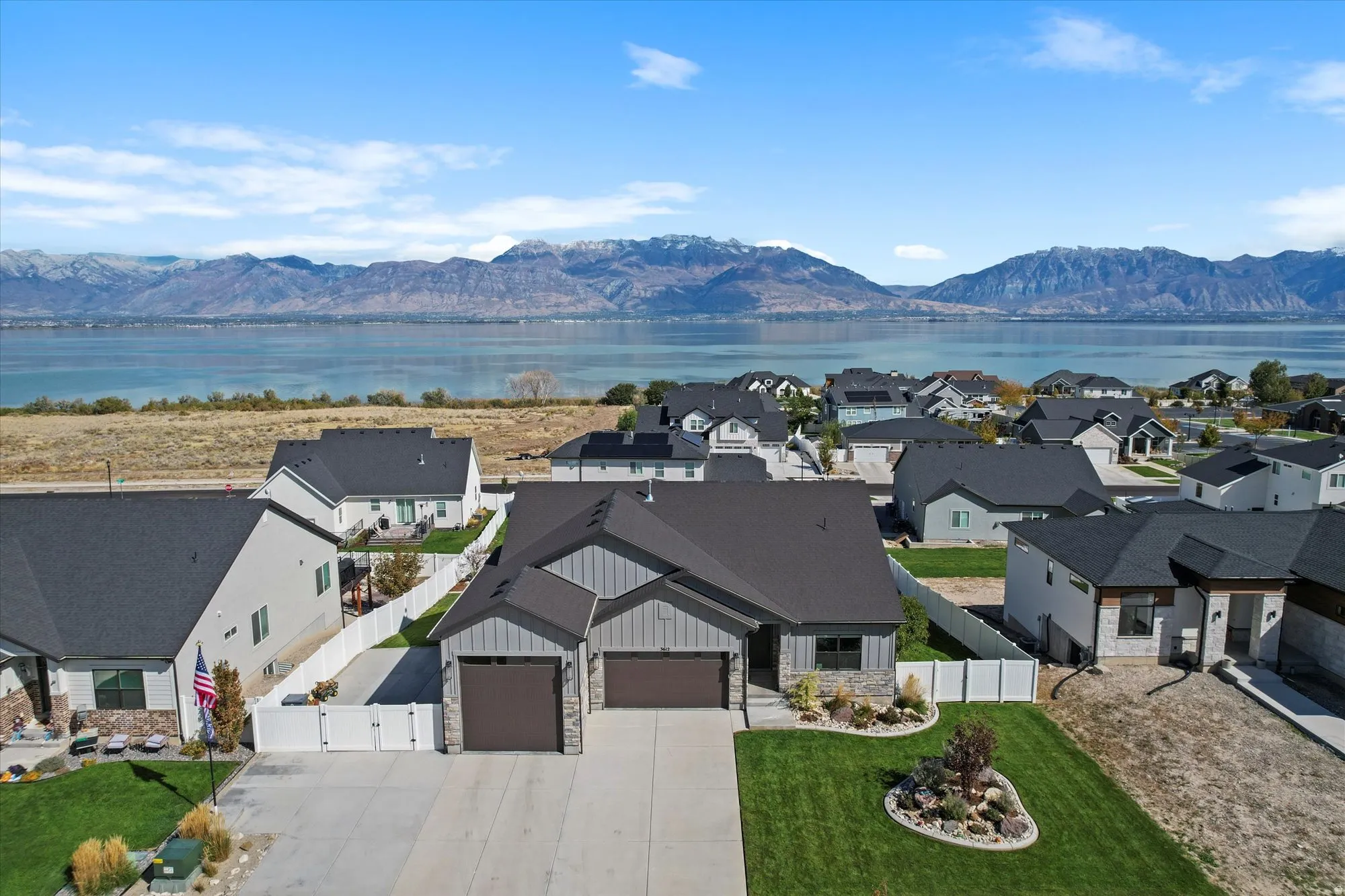 Aerial perspective of suburban area featuring a water and mountain view