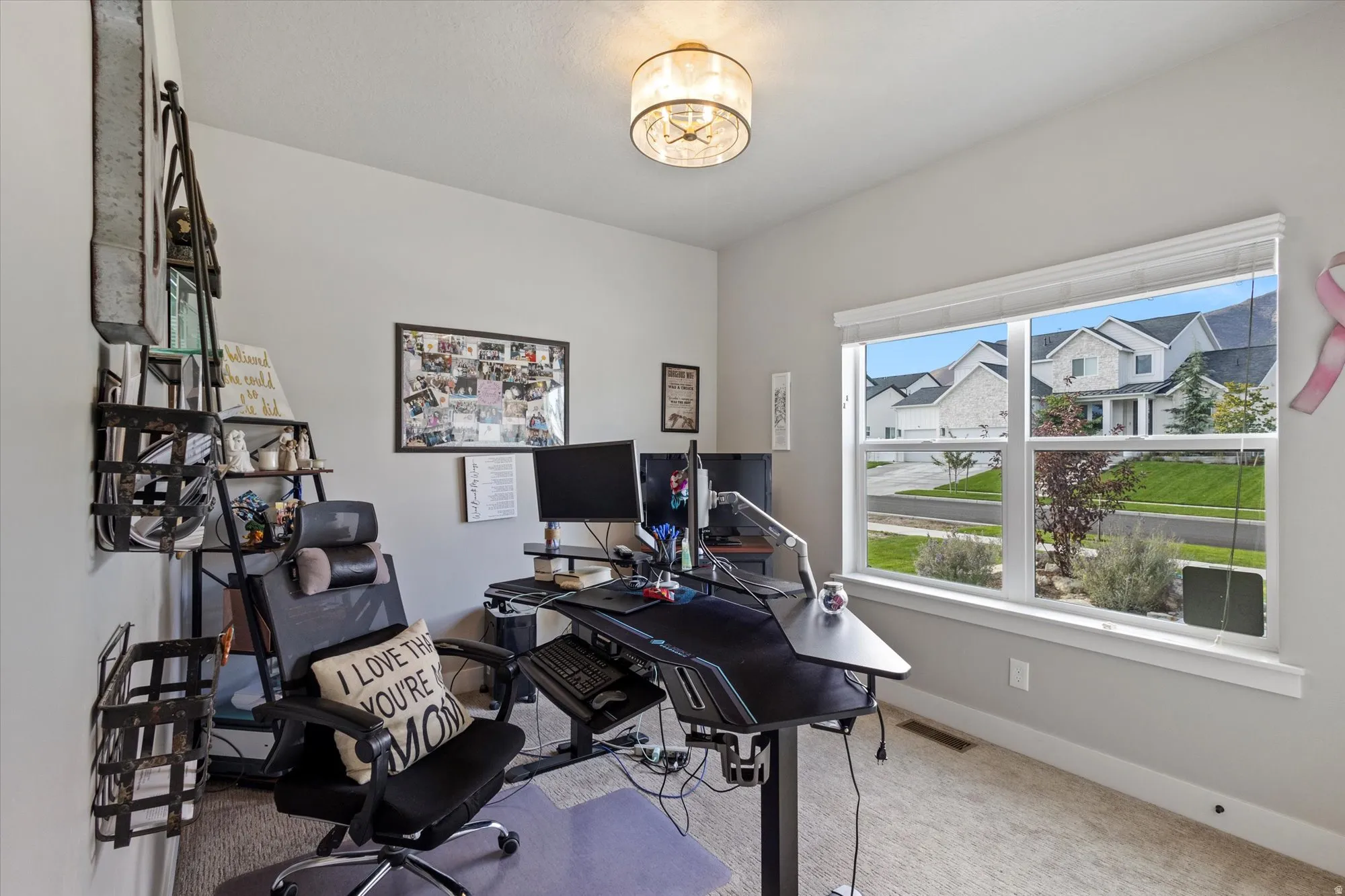 Office featuring light carpet and baseboards