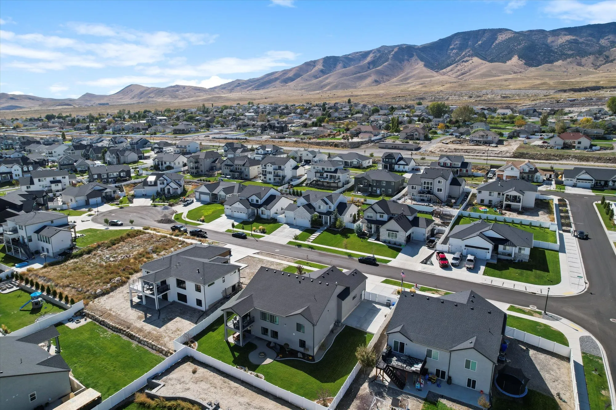 Aerial perspective of suburban area with a mountainous background