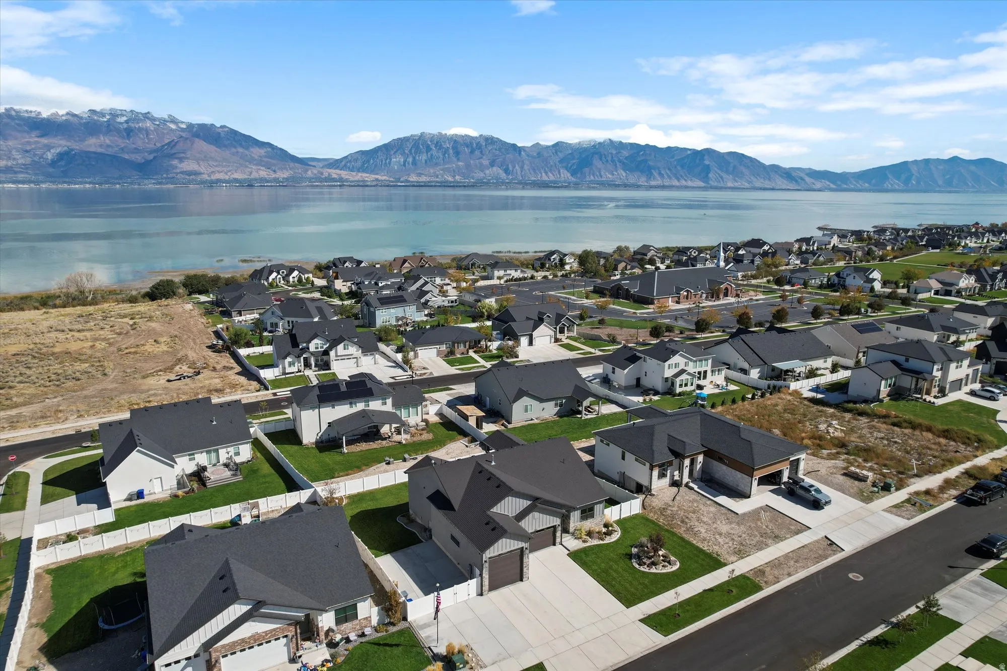 Aerial view of residential area featuring a water and mountain view