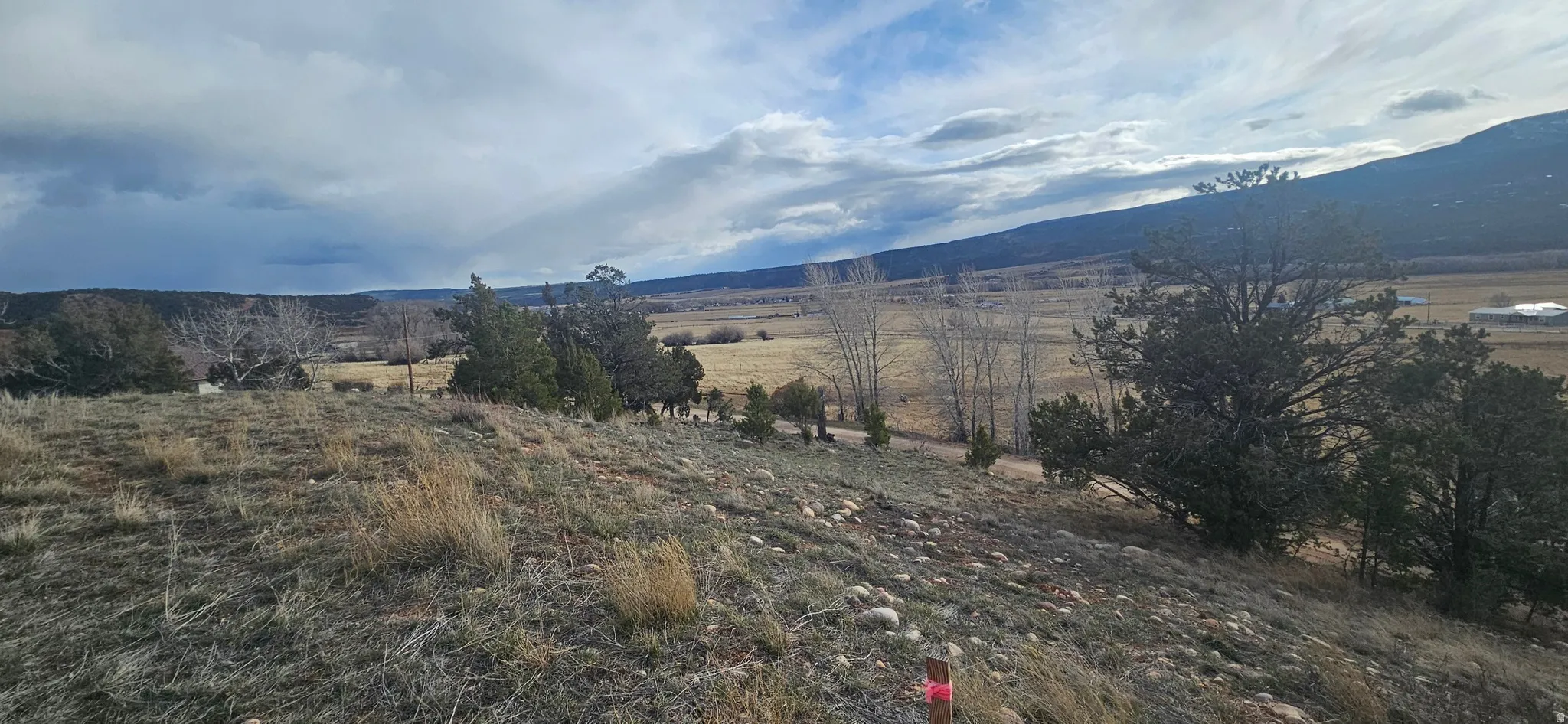 View of mountain backdrop with rural landscape
