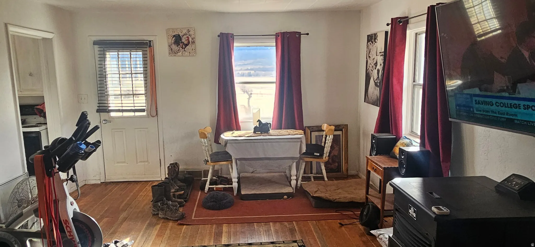 Dining area featuring dark wood-type flooring and baseboards