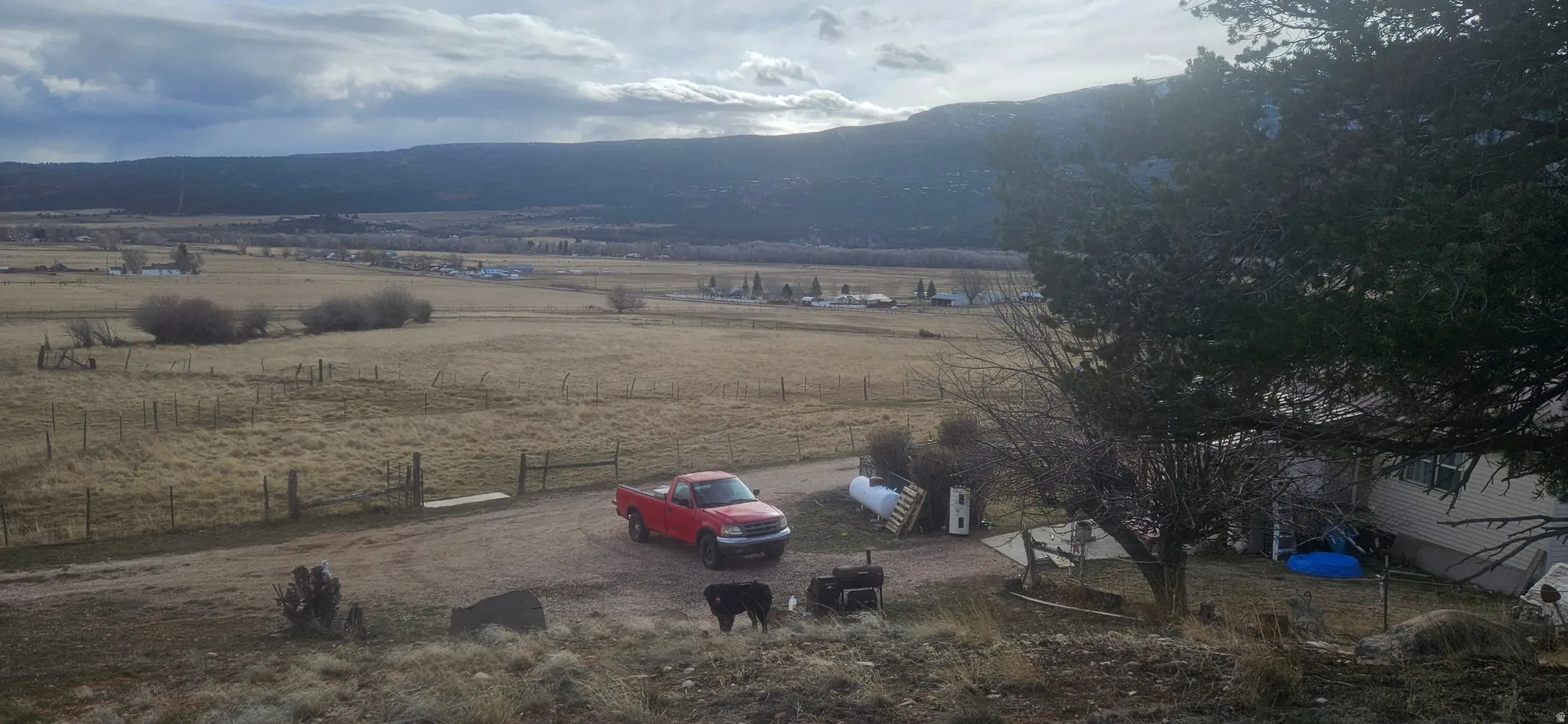 Overview of rural landscape featuring a mountain backdrop