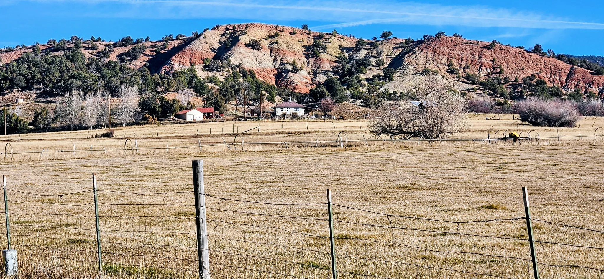 View of mountain backdrop with rural landscape