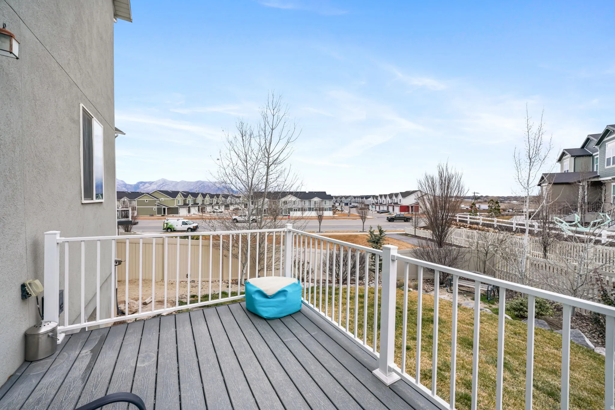 Deck featuring a residential view and a lawn