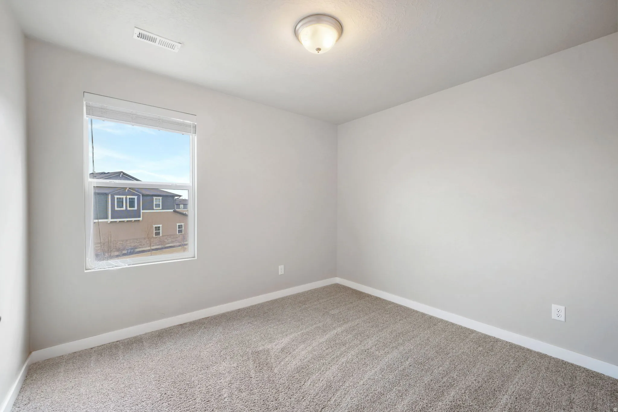 Unfurnished room with baseboards and carpet flooring