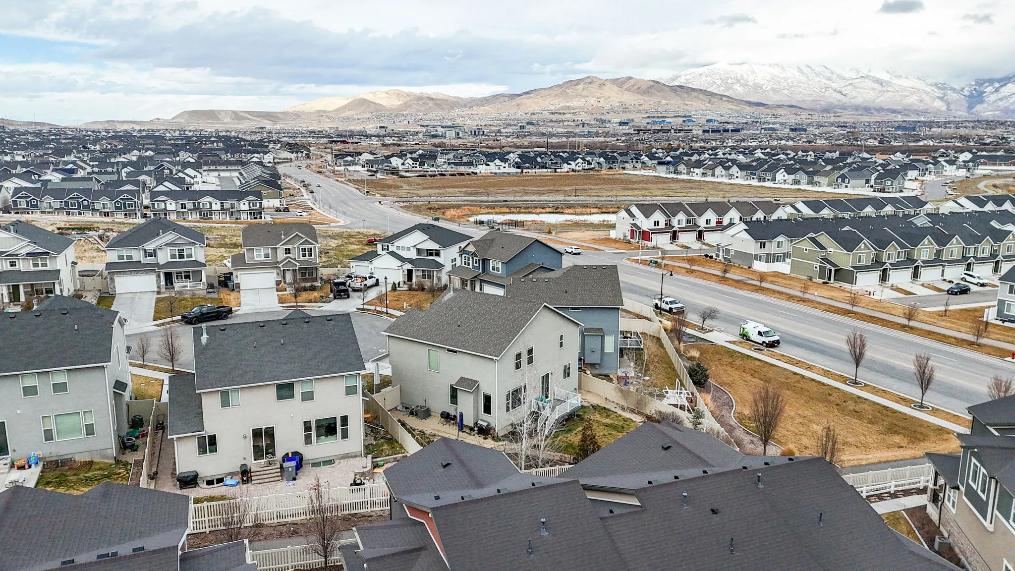 Aerial view of residential area featuring a mountainous background