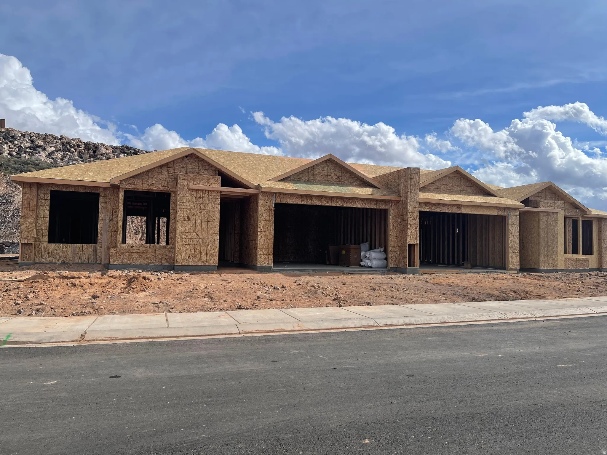 Property under construction featuring roof with shingles