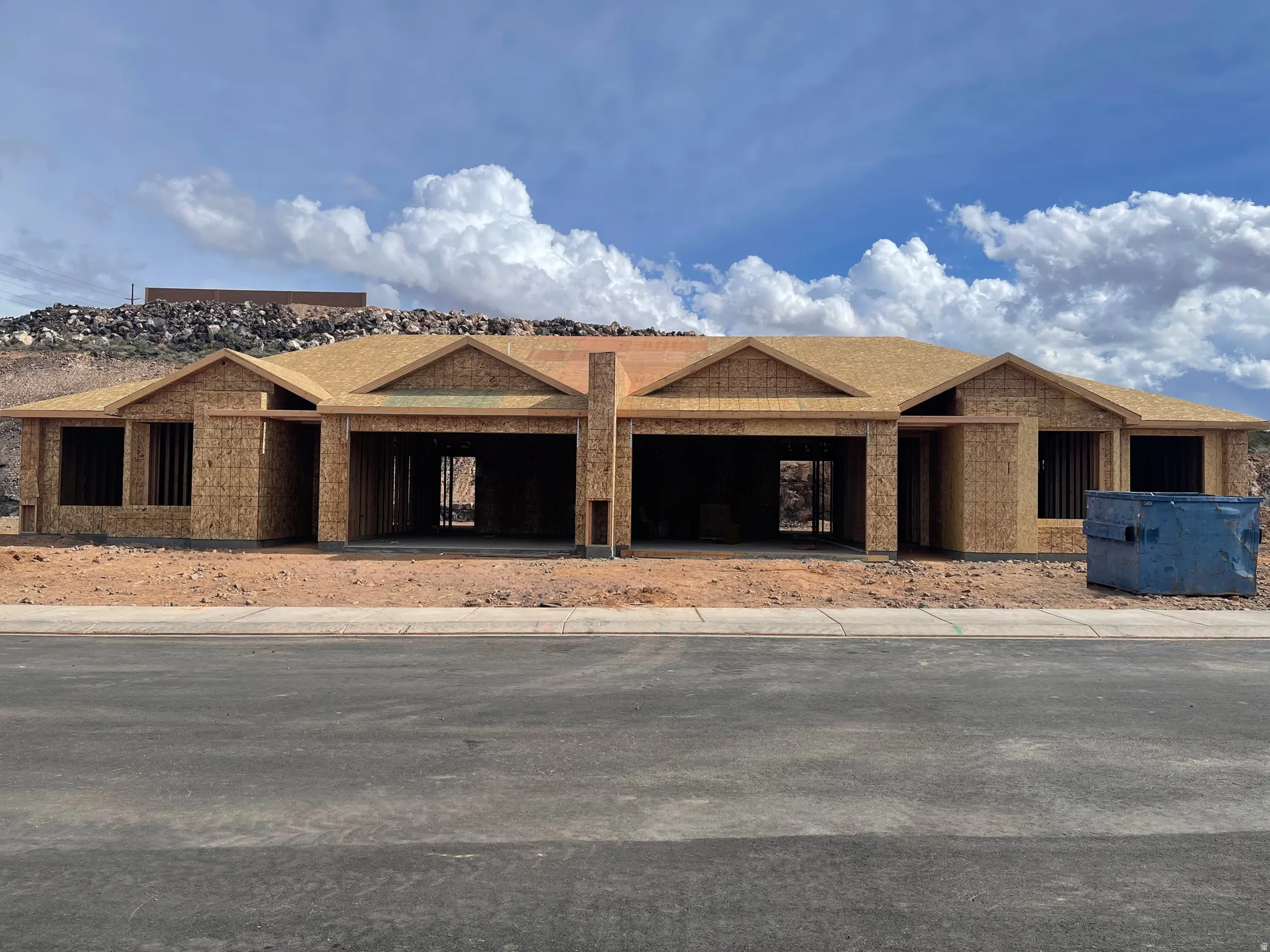 Property under construction featuring roof with shingles