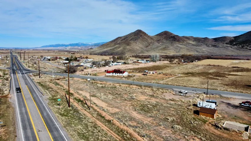 View of mountain backdrop with rural landscape